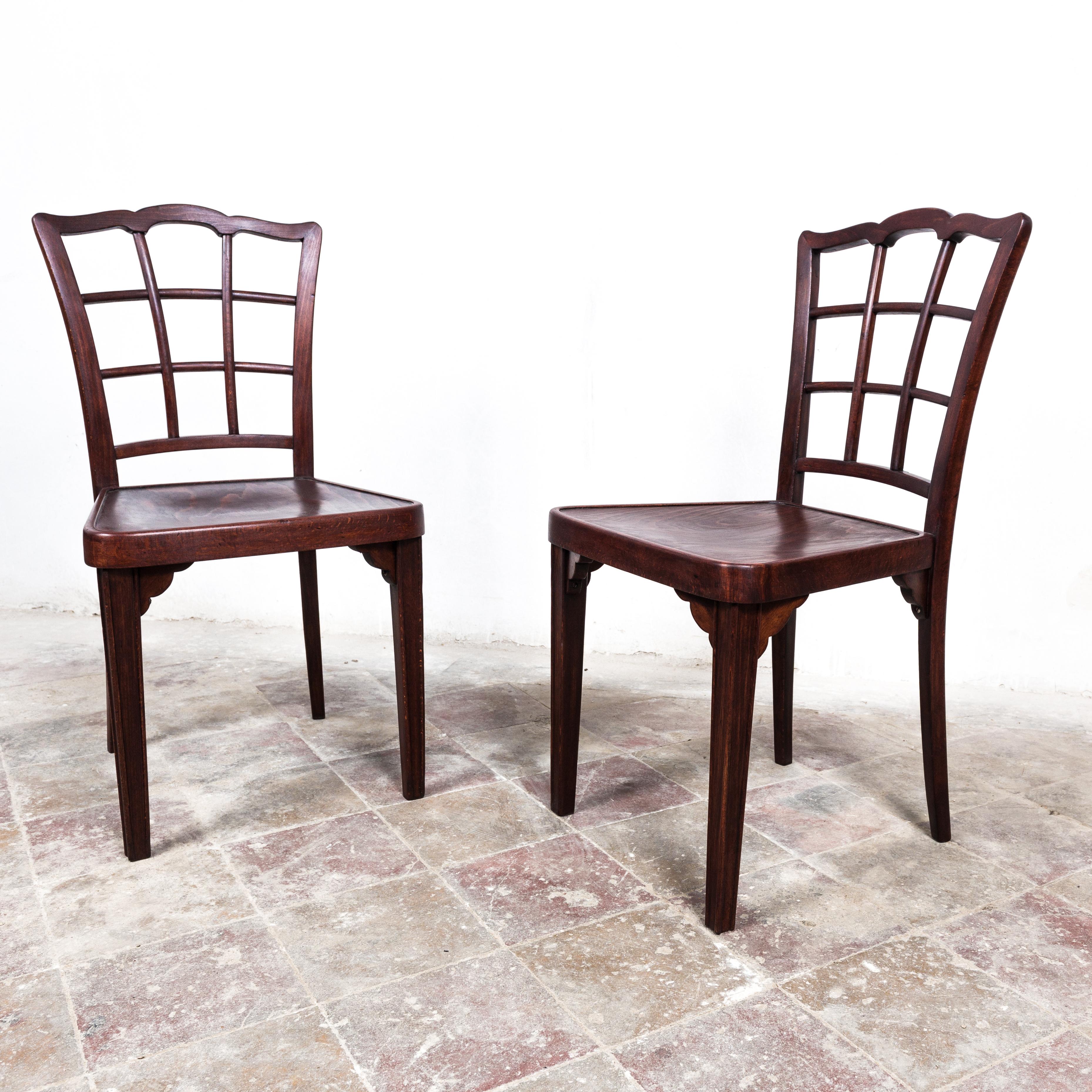 Extremely rare chairs by famous Viennese architect Otto Prutscher. Interestingly designed backrest shape, decorative wooden struts at the bottom under the seat in all corners. Chairs are expertly restored by a professional studio with long history
