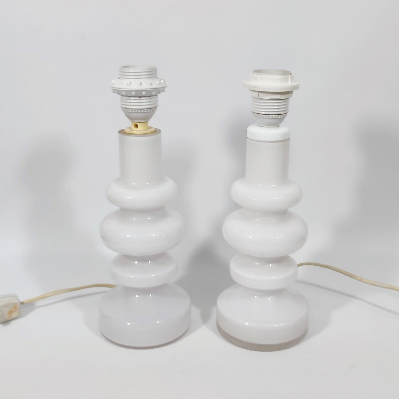 Rare find! Two milky white glass table lamps designed by Gunnar Ander for Lindshammar, Swedish late 1960's.
In original condition. No chips or other damages.
Shades are not included.
Equipped ith 2 E27 sockets, working in the US too with 110 V light