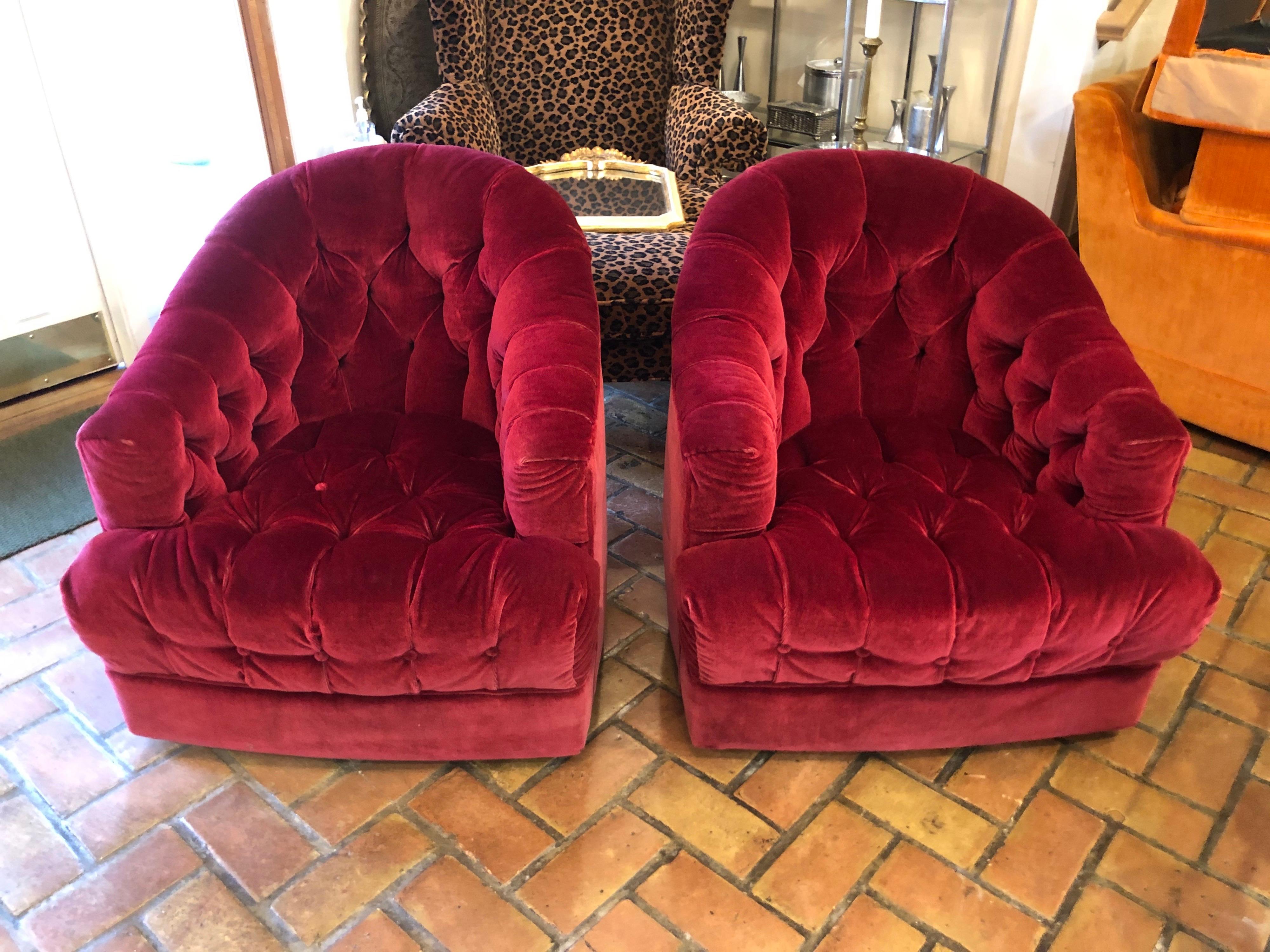 Pair of raspberry mohair swivel chairs by Directional. Amazing color and exceptional chesterfield style to these beauties. High end quality and design. Decorate a room around these stunners.