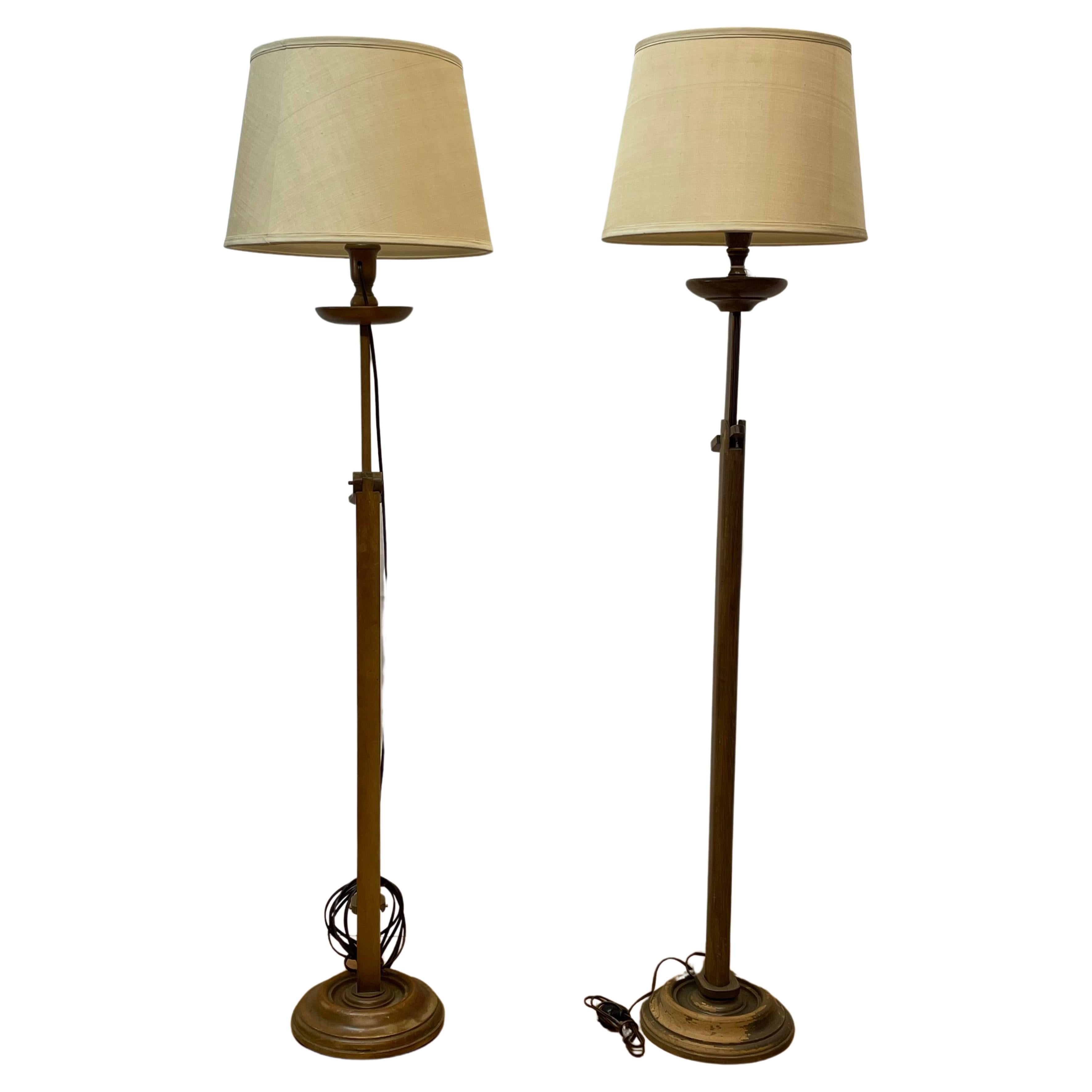 Pair of ratchet adjustable hand carved wood floor lamps with glass shades For Sale