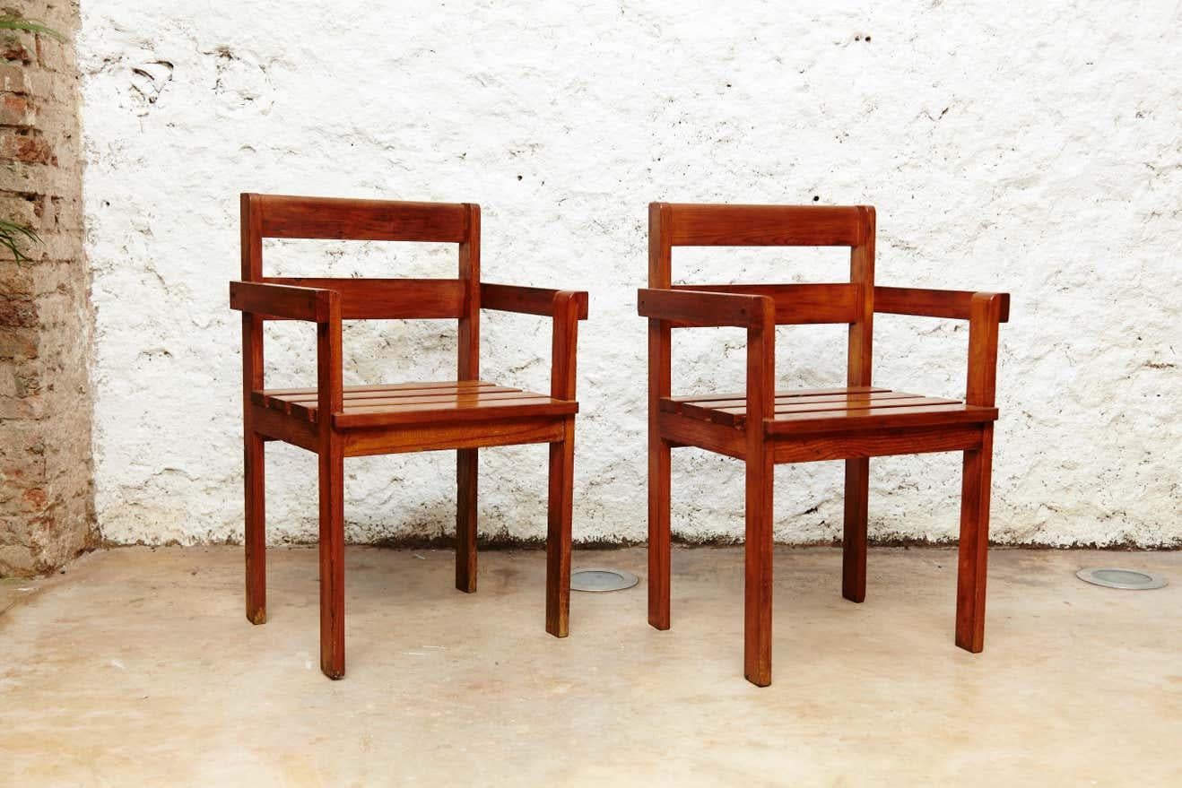 Pair of rationalist wood armchairs in the style of Gerrit Reitveld, circa 1950.
Made by Unknown manufacturer in Holland.

In original condition with minor wear consistent of age and use, preserving a beautiful patina.

Measurements:
81cm H x