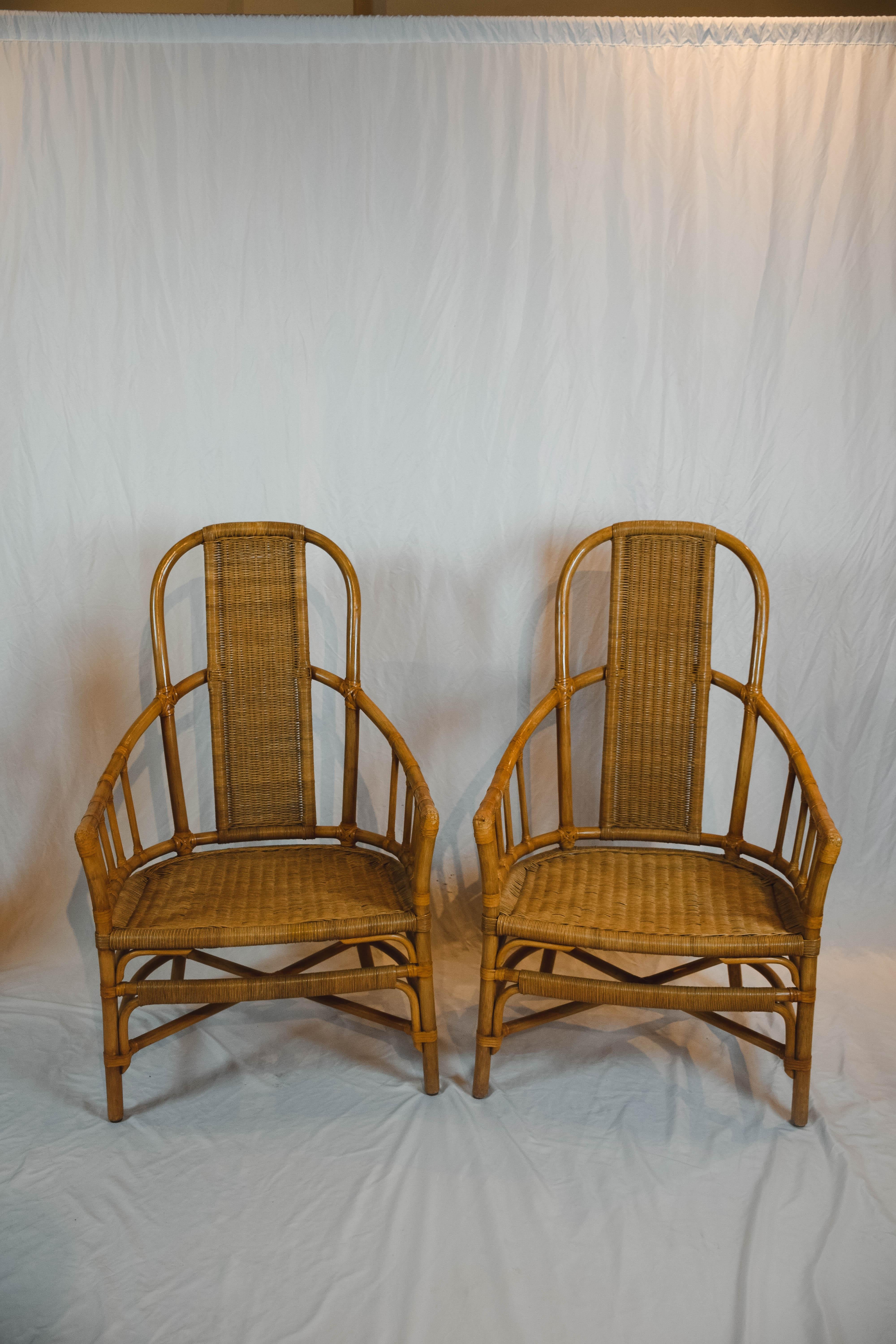 Pair of wonderful vintage rattan bentwood chairs in excellent condition. These comfortable barrel back chairs would be a great addition to your loggia or would be beautiful indoors as well. 

 