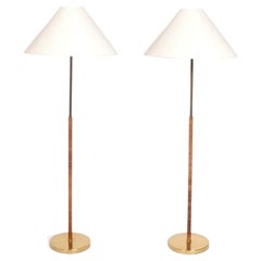 Pair of Rattan and Brass Floor Lamps in the Manner of Paavo Tynell