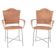 Pair of rattan and iron chairs