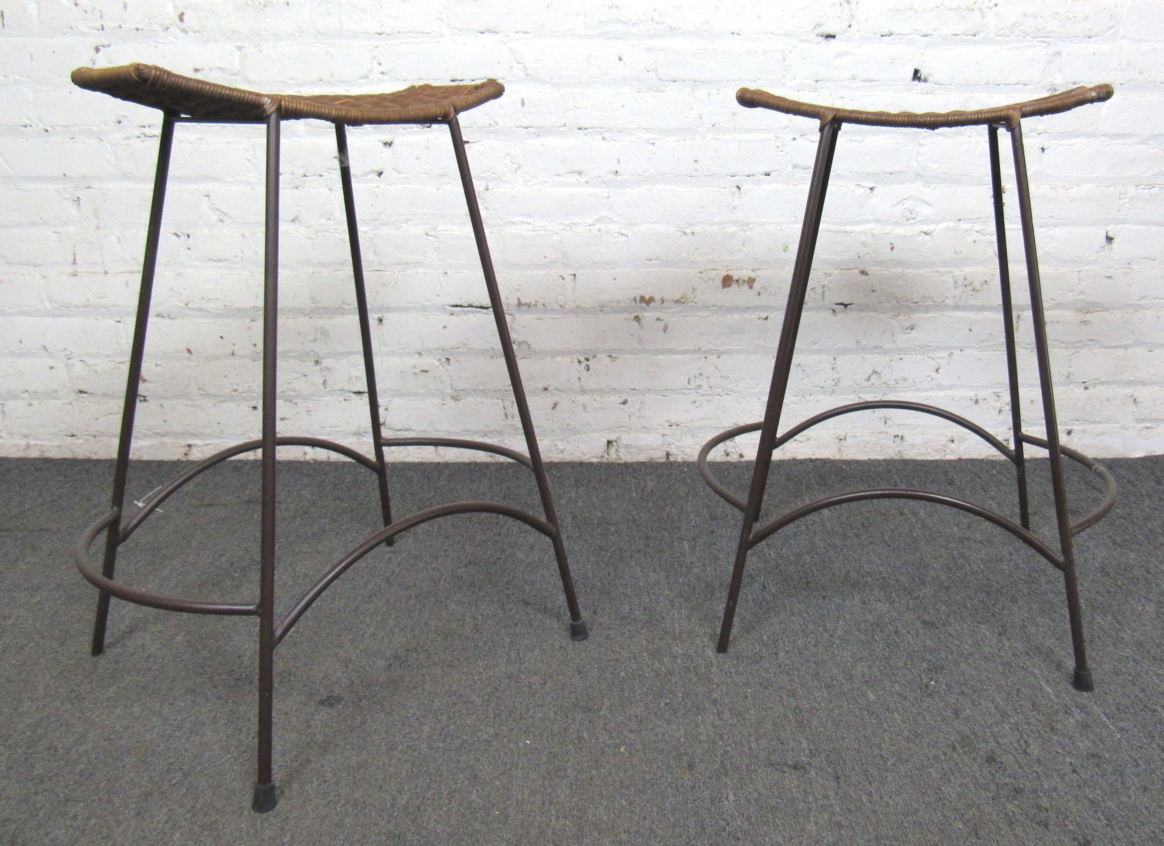 Jamie Young Wing counter stools with strong metal frame and rattan seats. Great modern style with crescent shaped seats.
(Please confirm location NY or NJ).