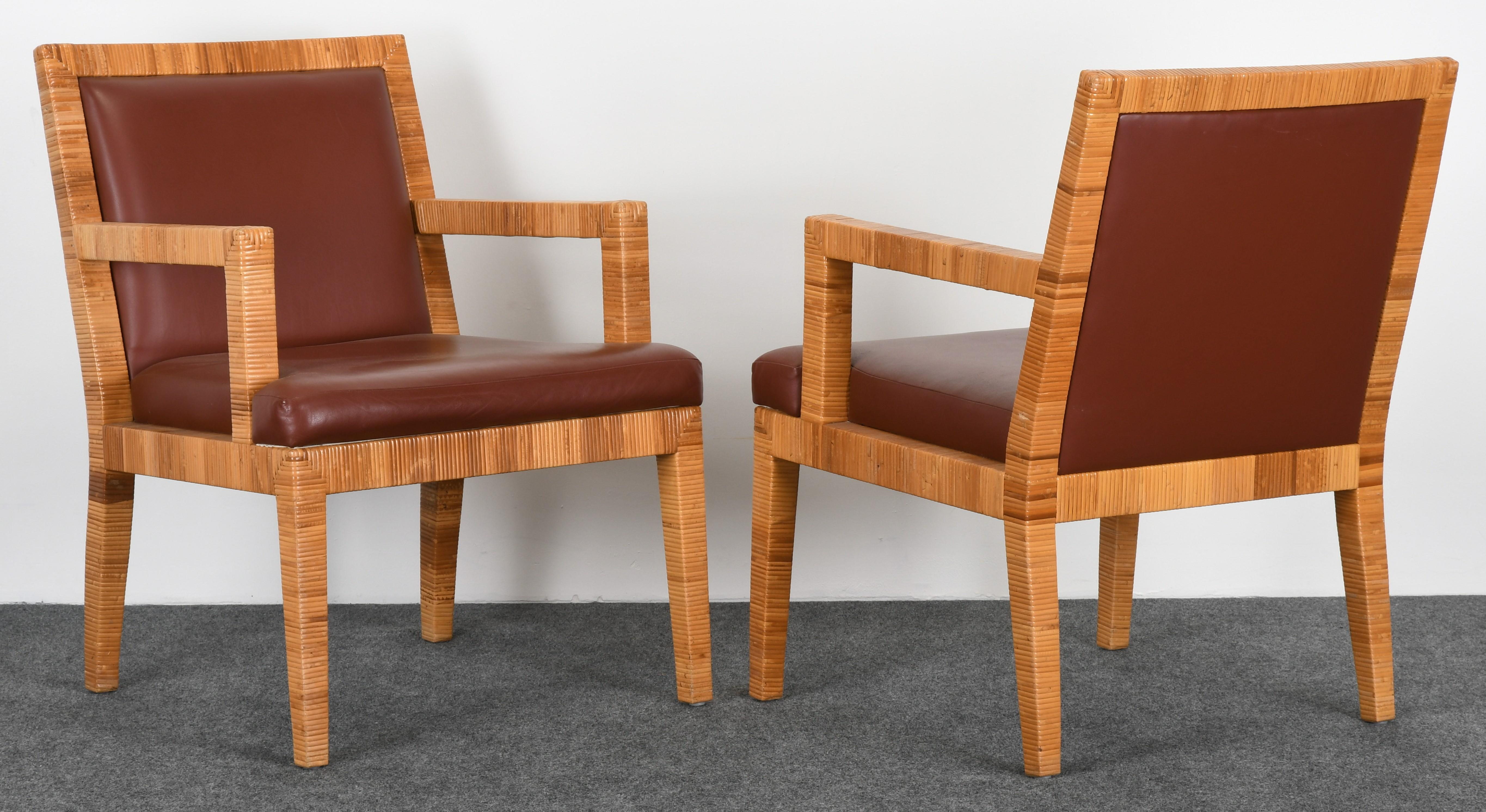 A pair of exquisite handwoven rattan and leather armchairs by the famous company, Bielecky Brothers. The furniture made by Bielecky Brothers is owned by celebrities and those with discerning taste around the globe. Structurally sound and in very