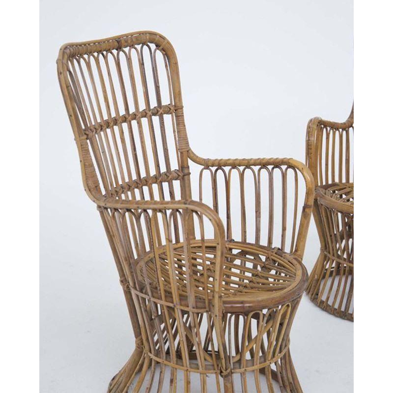 A pair of Italian Mid-Century Modern rattan armchairs by Luigi Caccia Dominioni, circa 1960s.

