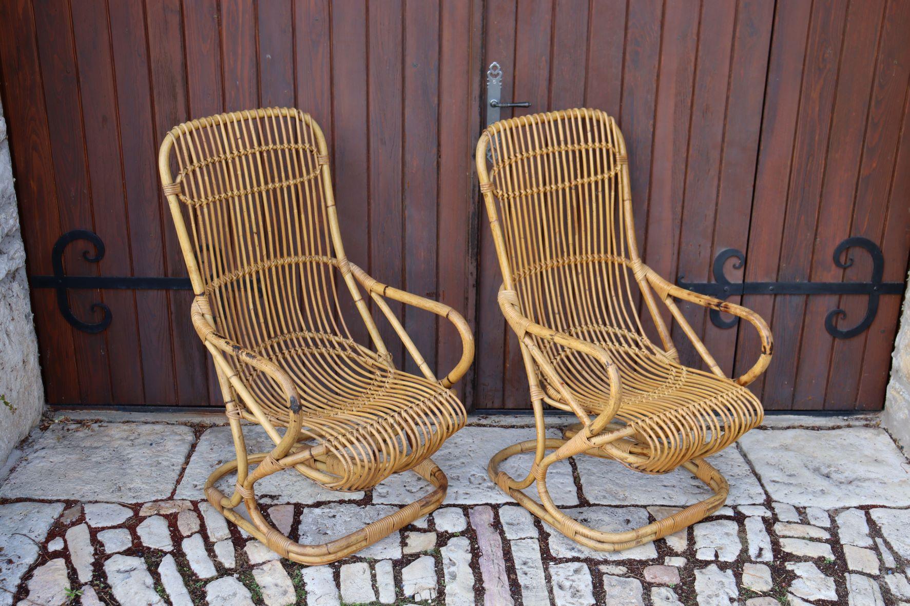 Pretty pair of rattan armchairs from the 60s by tito agnoli, made by bonacina.