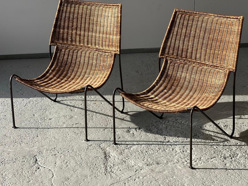 Pair of Frederic Weinberg USA 1950 rattan armchairs. 
Seat in good condition 
Black metal frame 
