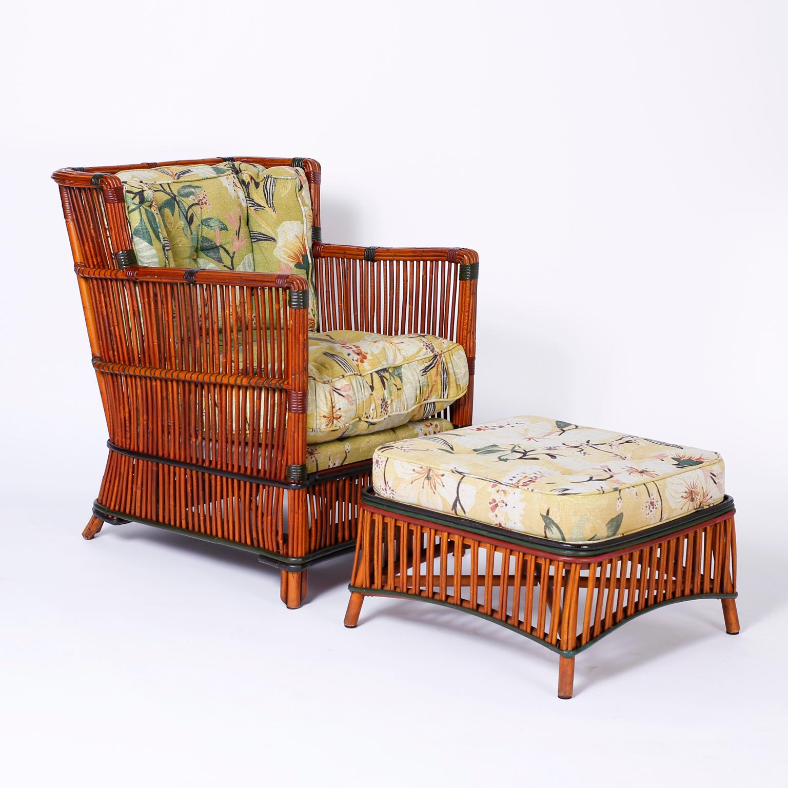 Pair of vintage rattan or stick wicker armchairs and ottomans with a casual elegance that invites comfort. Featuring reed wrapped construction and remarkable preserved period upholstery.

Chairs- H 33, W 26, D 30, SH 18 
Ottomans- H 14, W 22, D