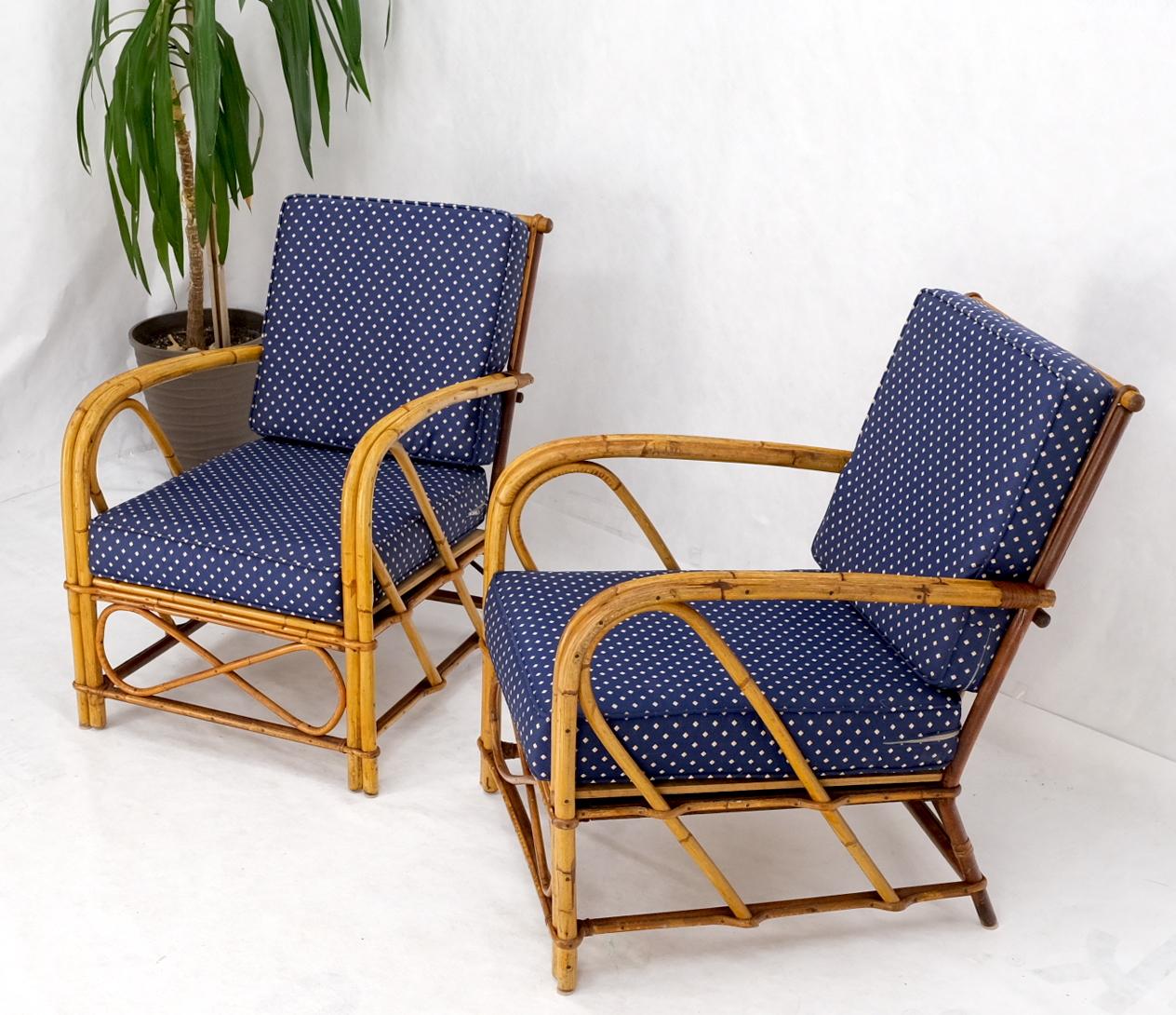 Pair of vintage c1970s rattan bamboo lounge chairs.