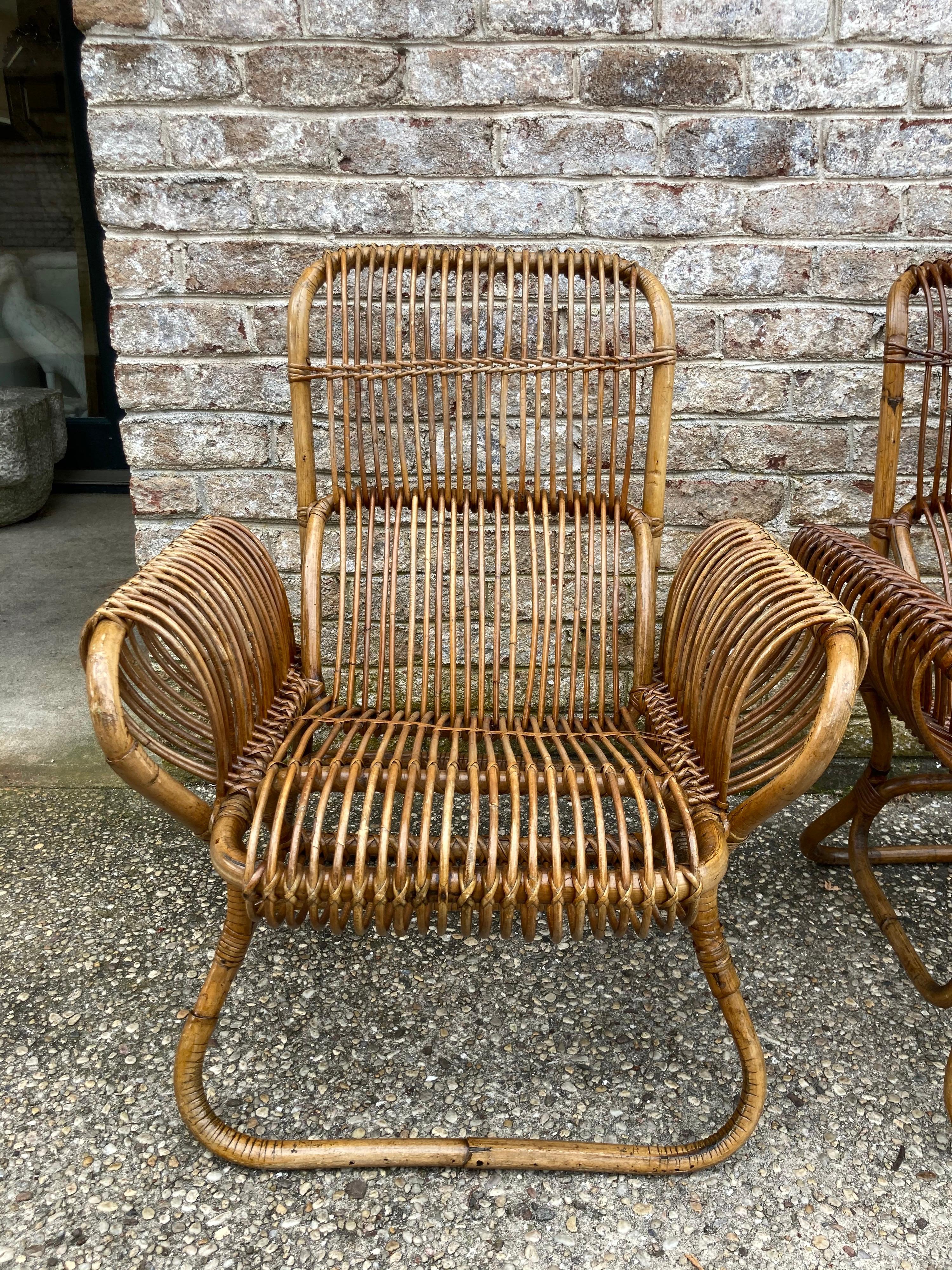 Sculptural pair of rattan armchairs attributed to Franco Albini.