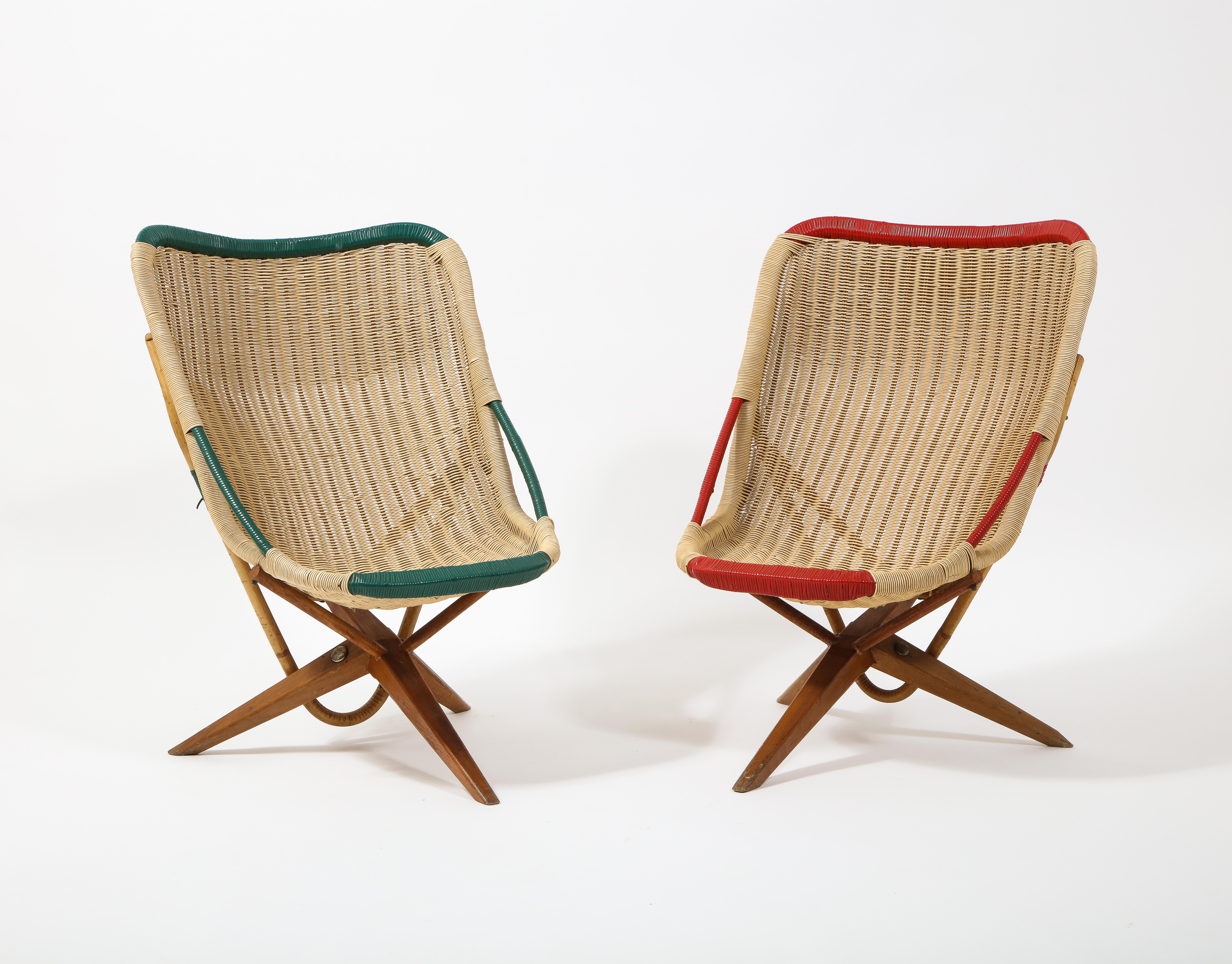 Pair of Chistera Rattan chairs on tripod legs, the design reminiscent of Motte famous version, not sure which came first but we've never seen those before.