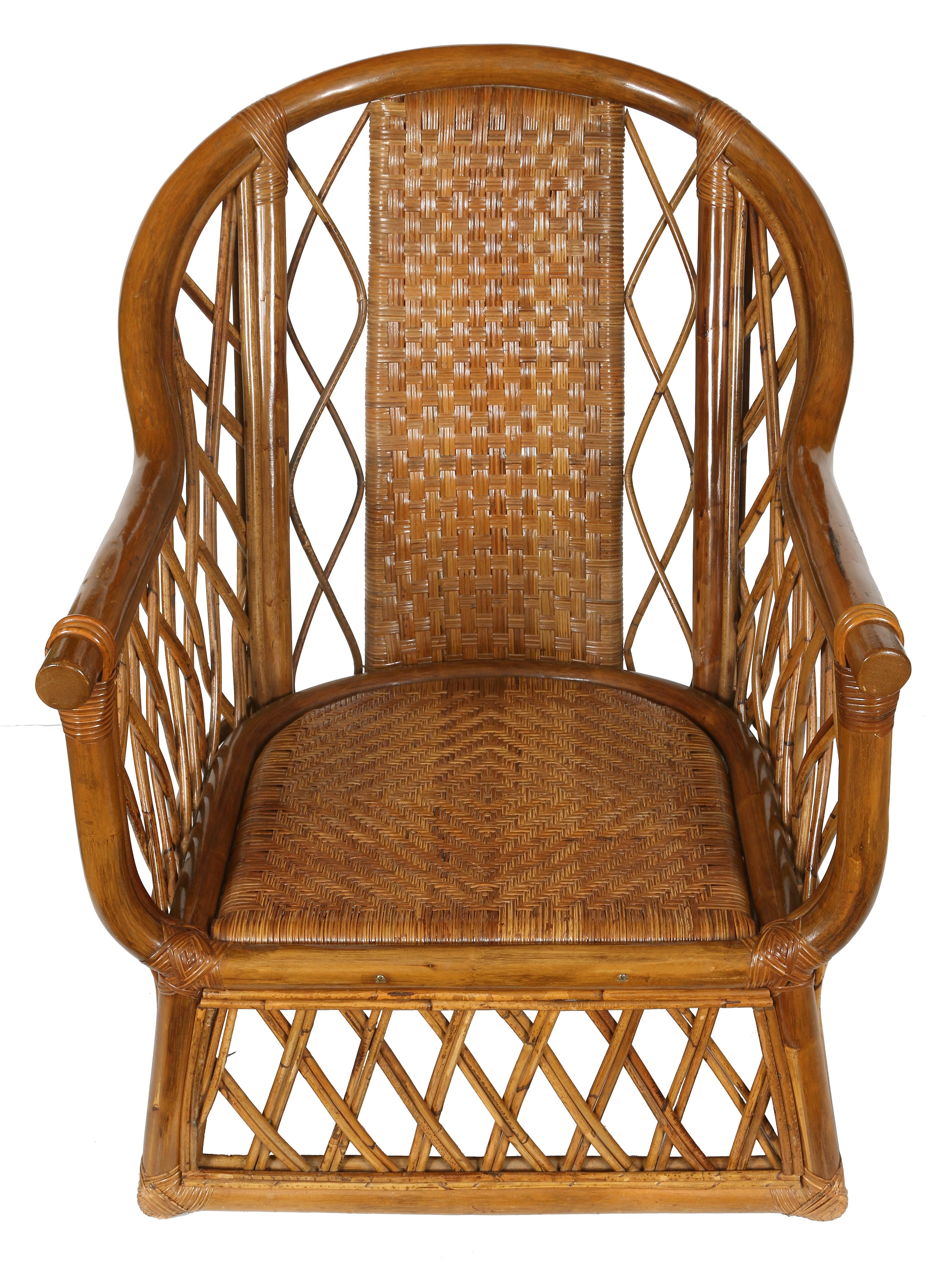 A pair of vintage rattan club chairs with cushions. This duo has great detailing, including a tightly woven back and seat, surrounded by an open diamond pattern on sides and base of chair. Quite solid and comfortable, these are a great option for