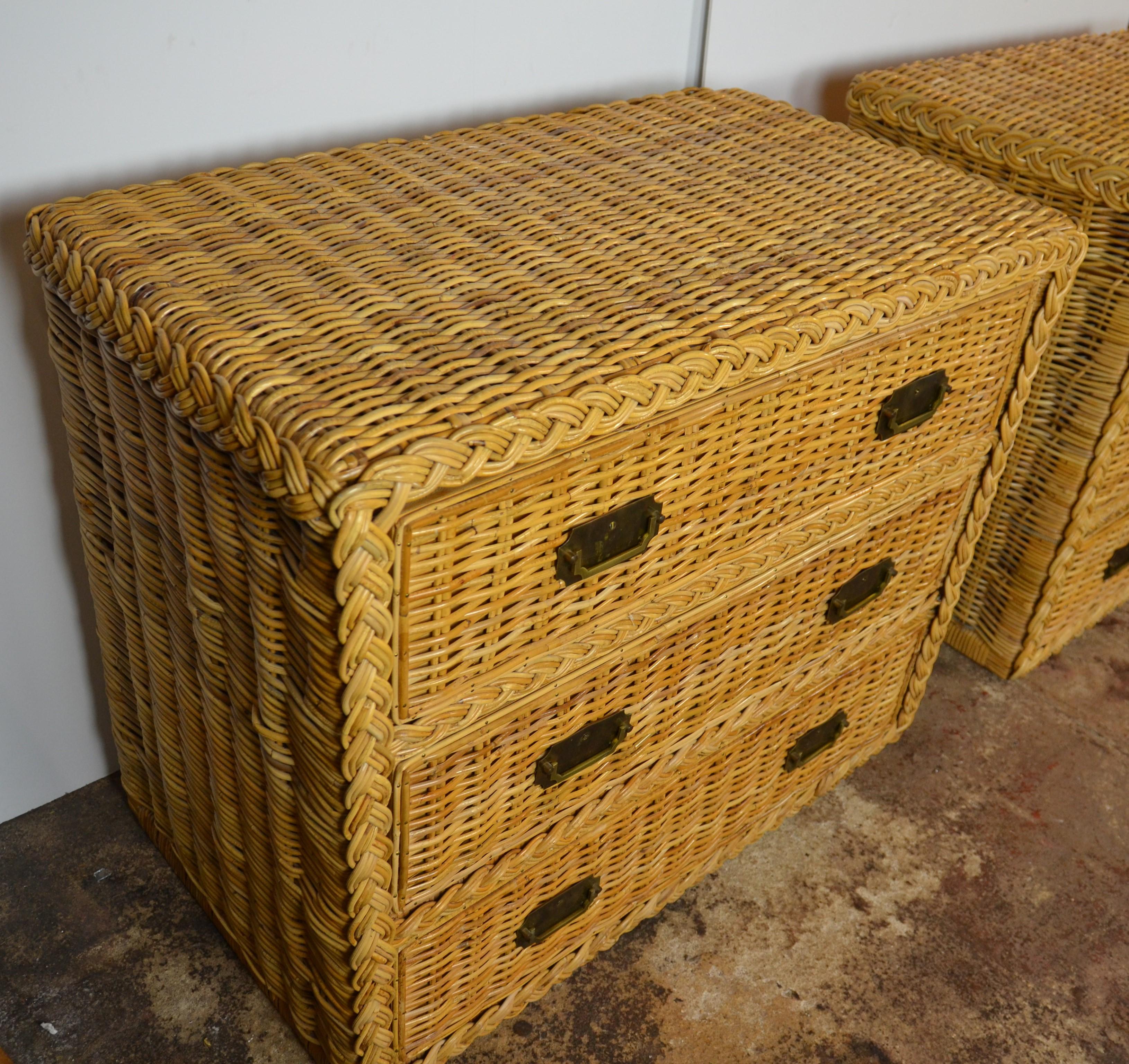 Vintage 1960s mid-century woven rattan commodes
3 drawer
Striking mid-century woven rattan dresser, c. 1960s. This stunning three-drawer basketweave reed chest is designed with brass campaign-style pulls. 

 