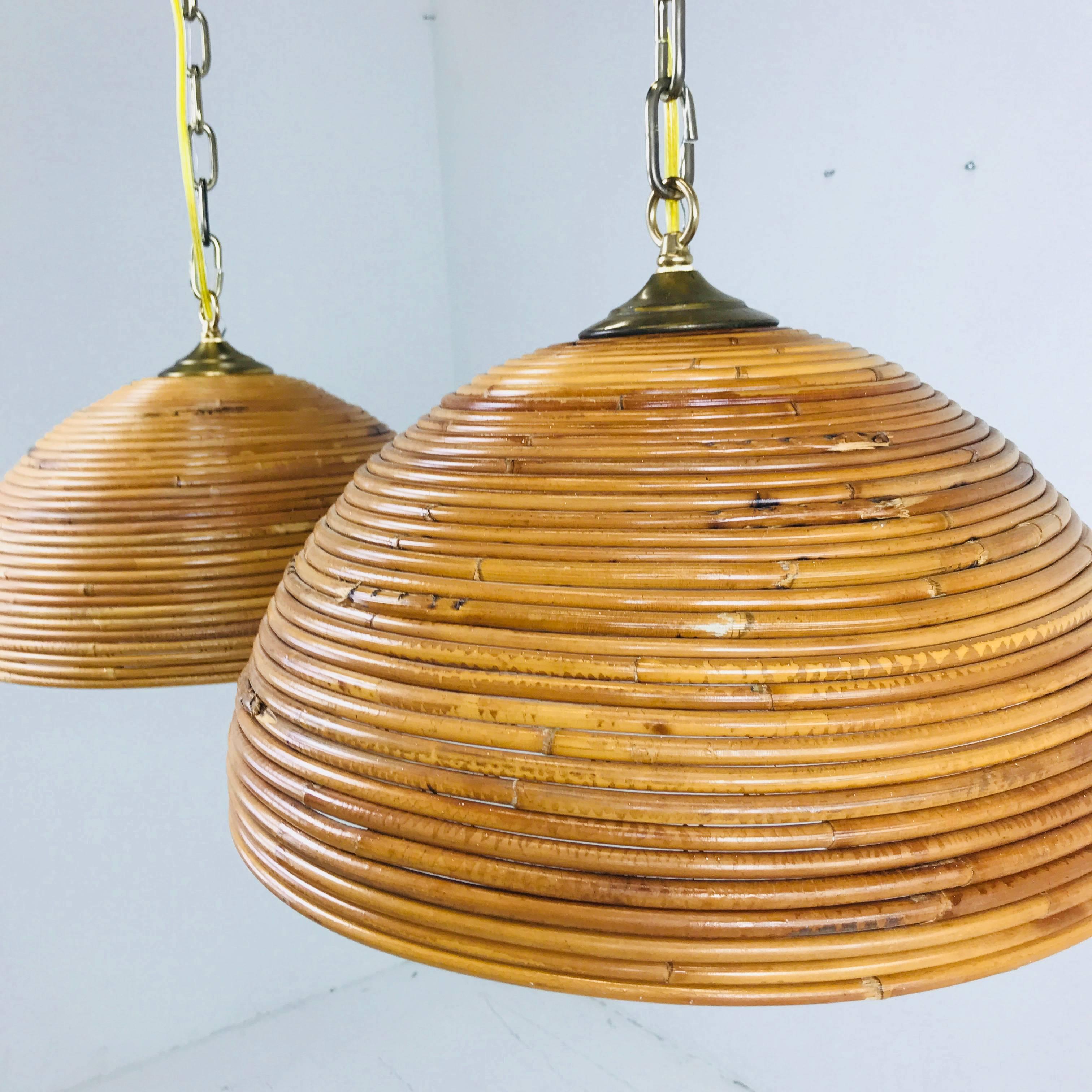 Pair of rattan dome pendants. Rattan domes are in good condition with new wiring.

Dimensions:
17.5