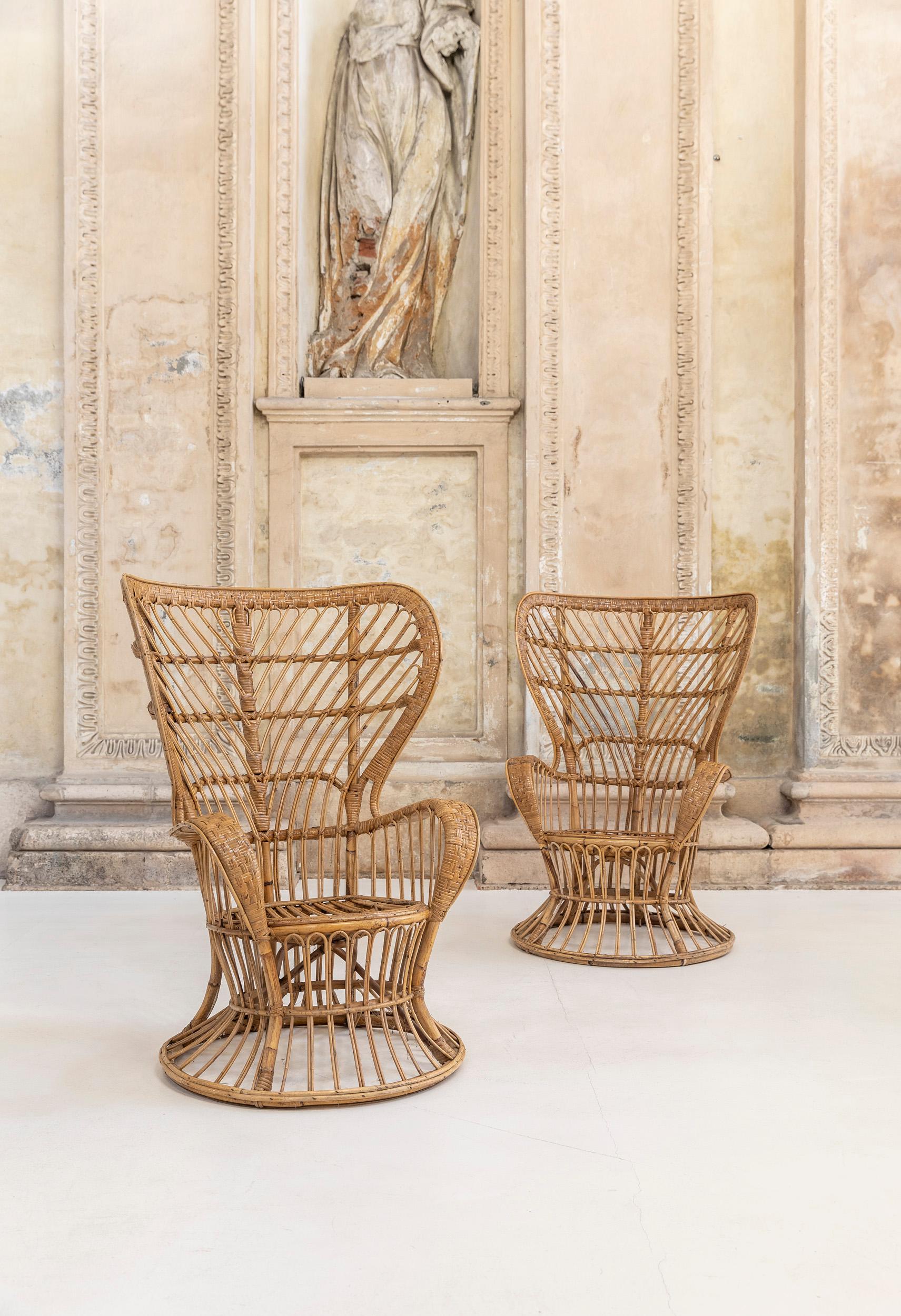Mid-Century Modern vintage armchairs or wingback chairs made of stained rattan by Lio Carminati and Gio Ponti.
Designed in 1948 in Italy and manufactured in the '50s. 
This iconic pieces show a high wingback with a peculiar weave in rattan, the