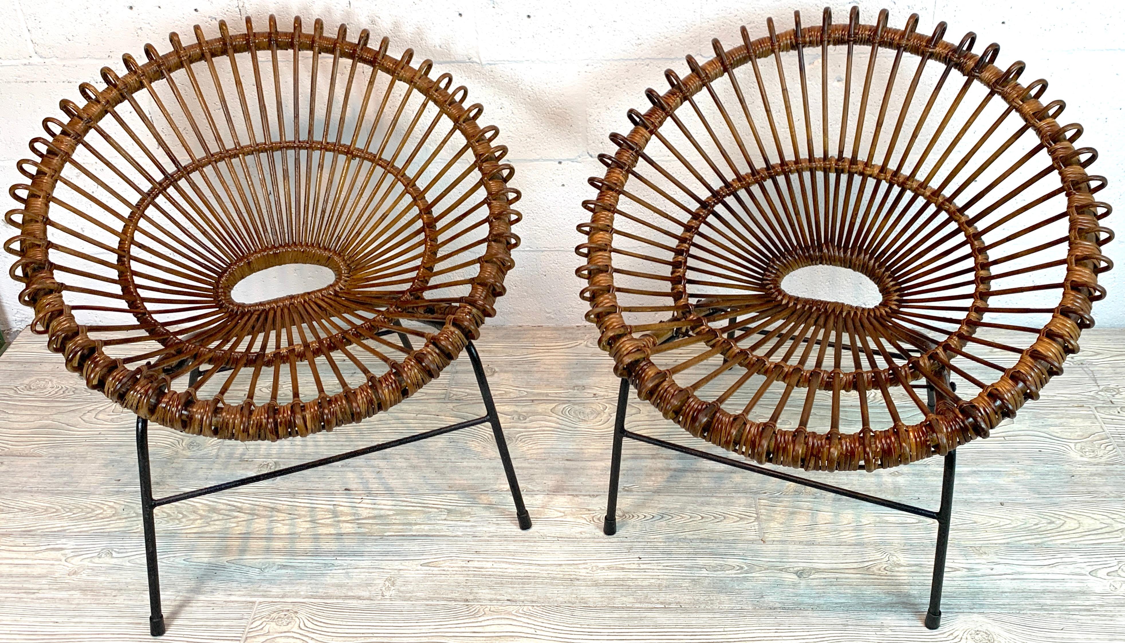 Pair of rattan hoop chairs, Janine Abraham DirkJan Rol France circa 1960 restored
Each one a fine example of intricate woven rattan, wicker, and reed, raised on iron frames. Beautiful condition, and color, ready to place. 

  