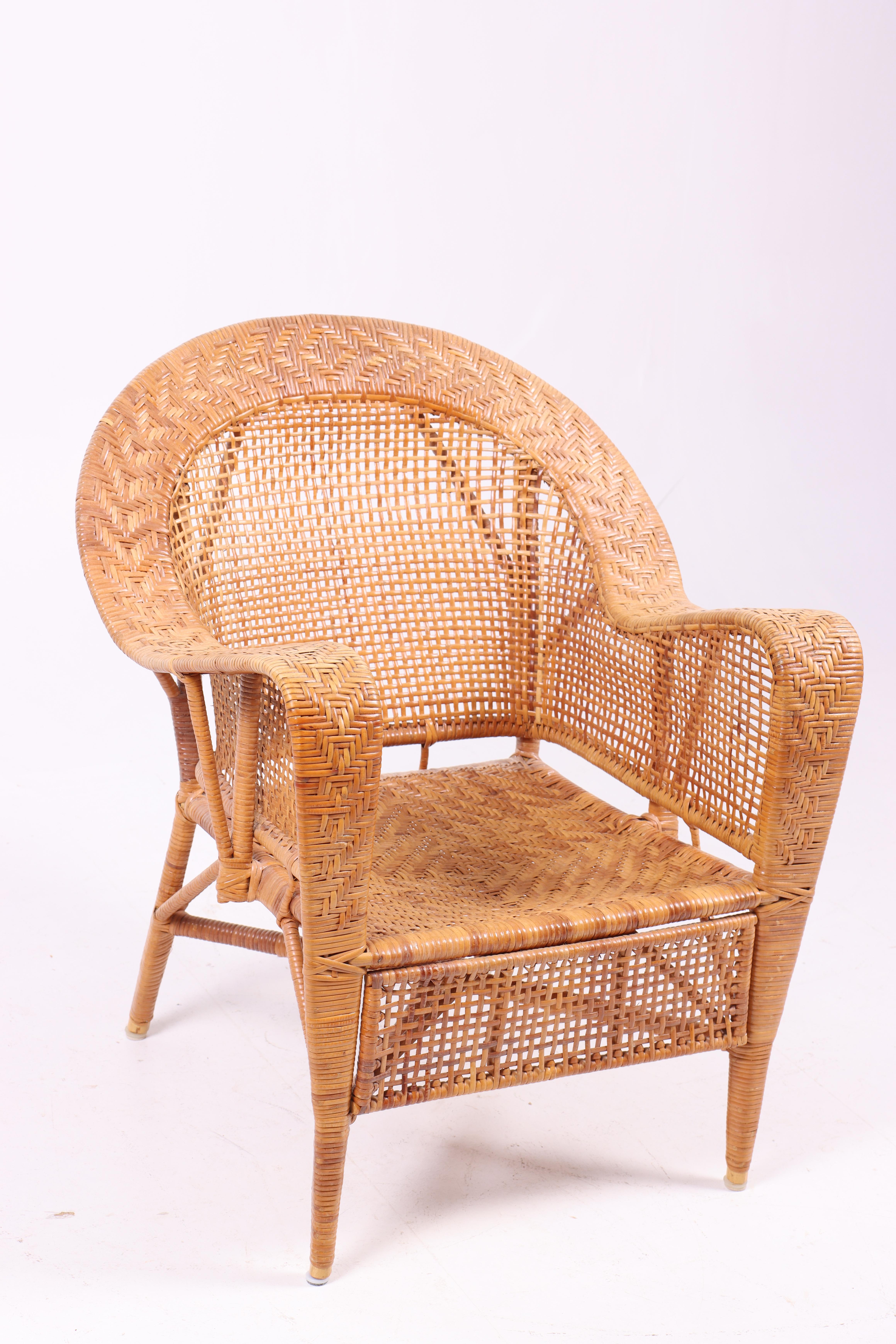 Scandinavian Modern Pair of Rattan Lounge Chairs by Kay Fisker, 1950s For Sale