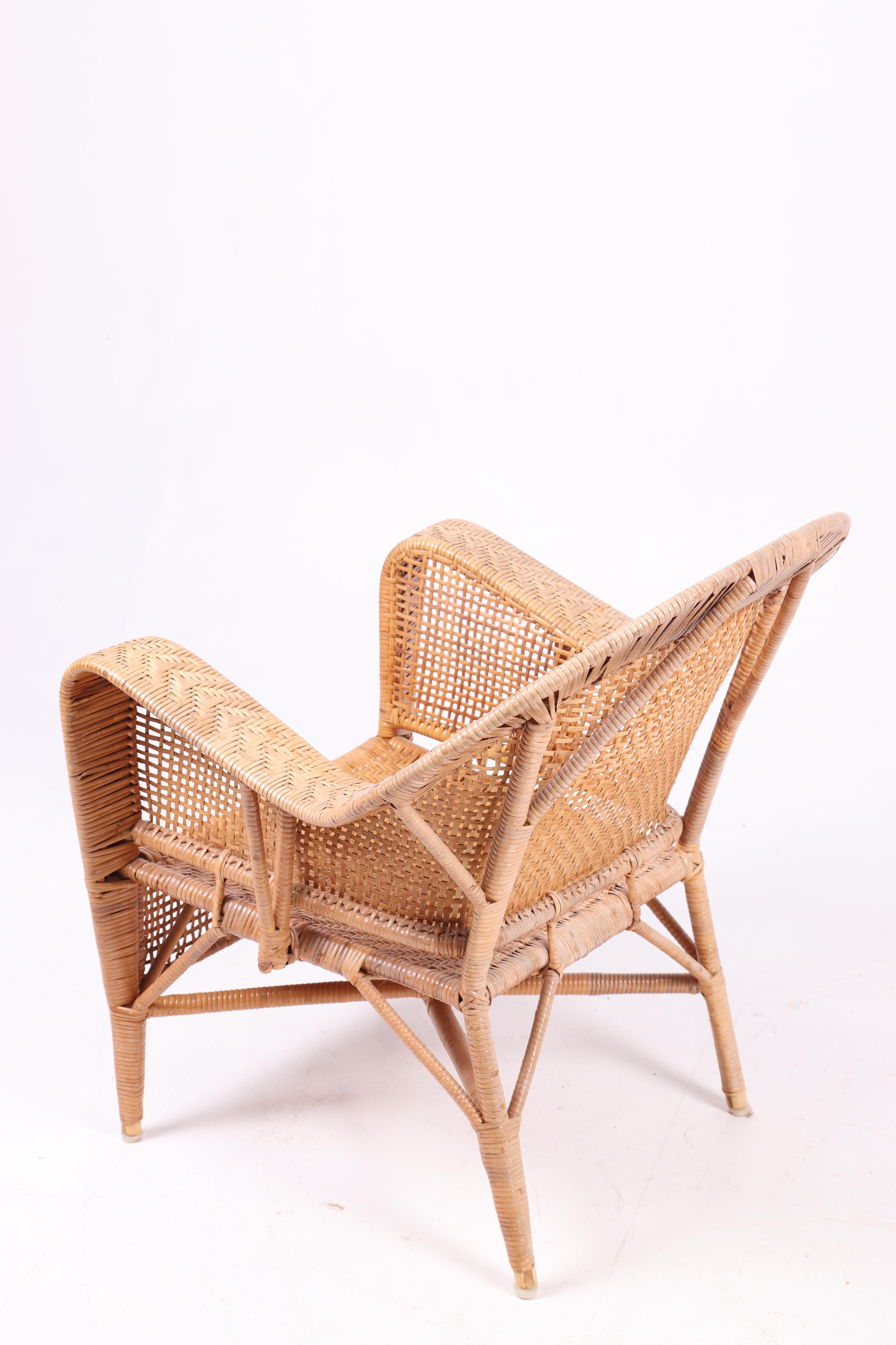 Mid-20th Century Pair of Rattan Lounge Chairs by Kay Fisker, 1950s For Sale
