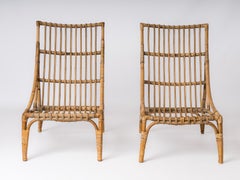 Pair of Rattan Lounge Chairs in the style of Audoux Minnet - France 1960's