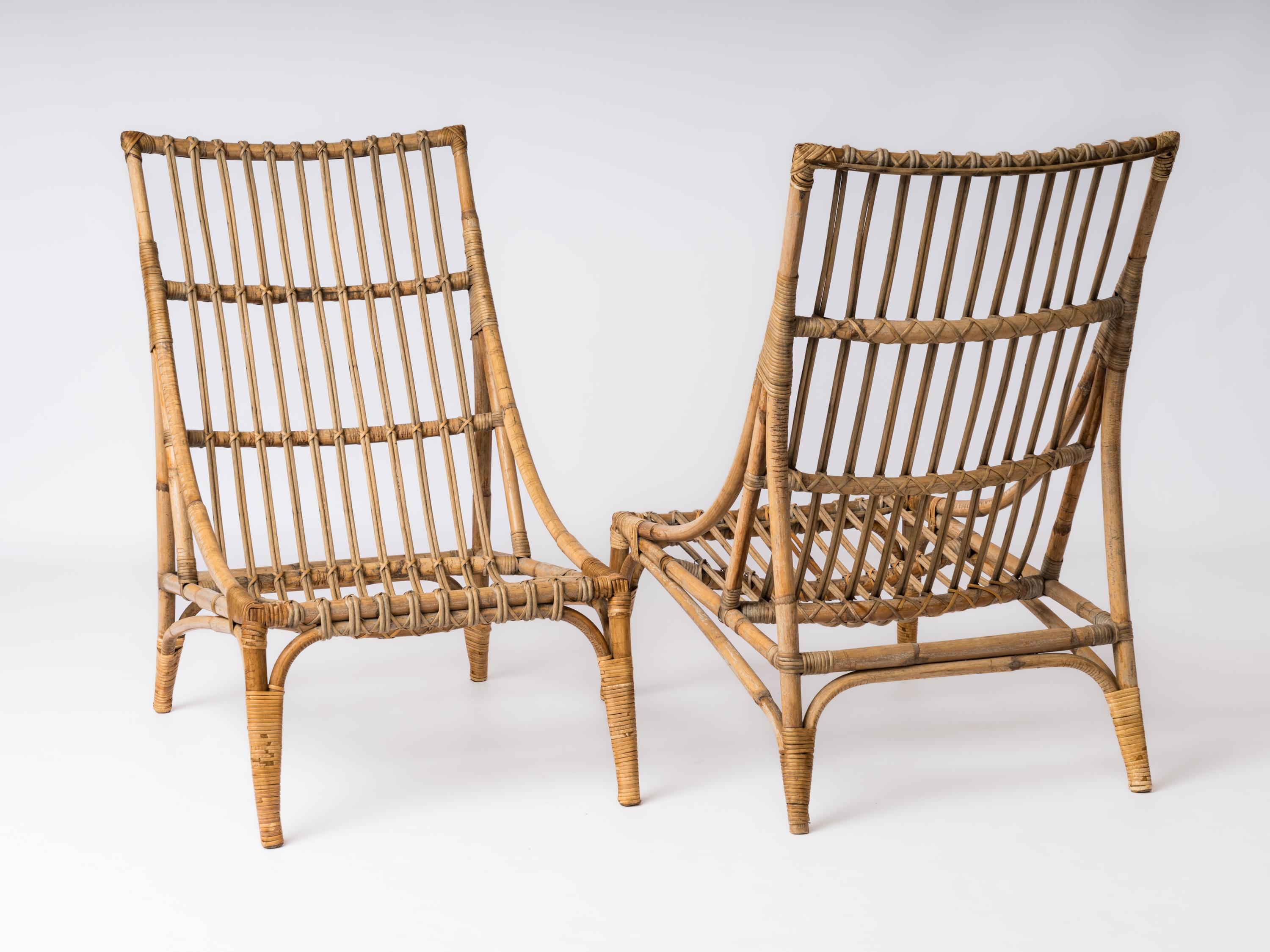 Pair of Rattan Lounge Chairs in the style of Audoux Minnet - France 1960's In Fair Condition For Sale In New York, NY