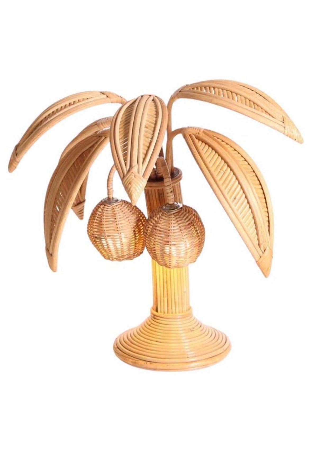 Lovely pair of rattan lamps with adjustable palms and lights in the coconuts.
Very decorative, these lamps are a promise of holidays and sun.
They are the result of a high quality work, all hand made! Excellent condition.