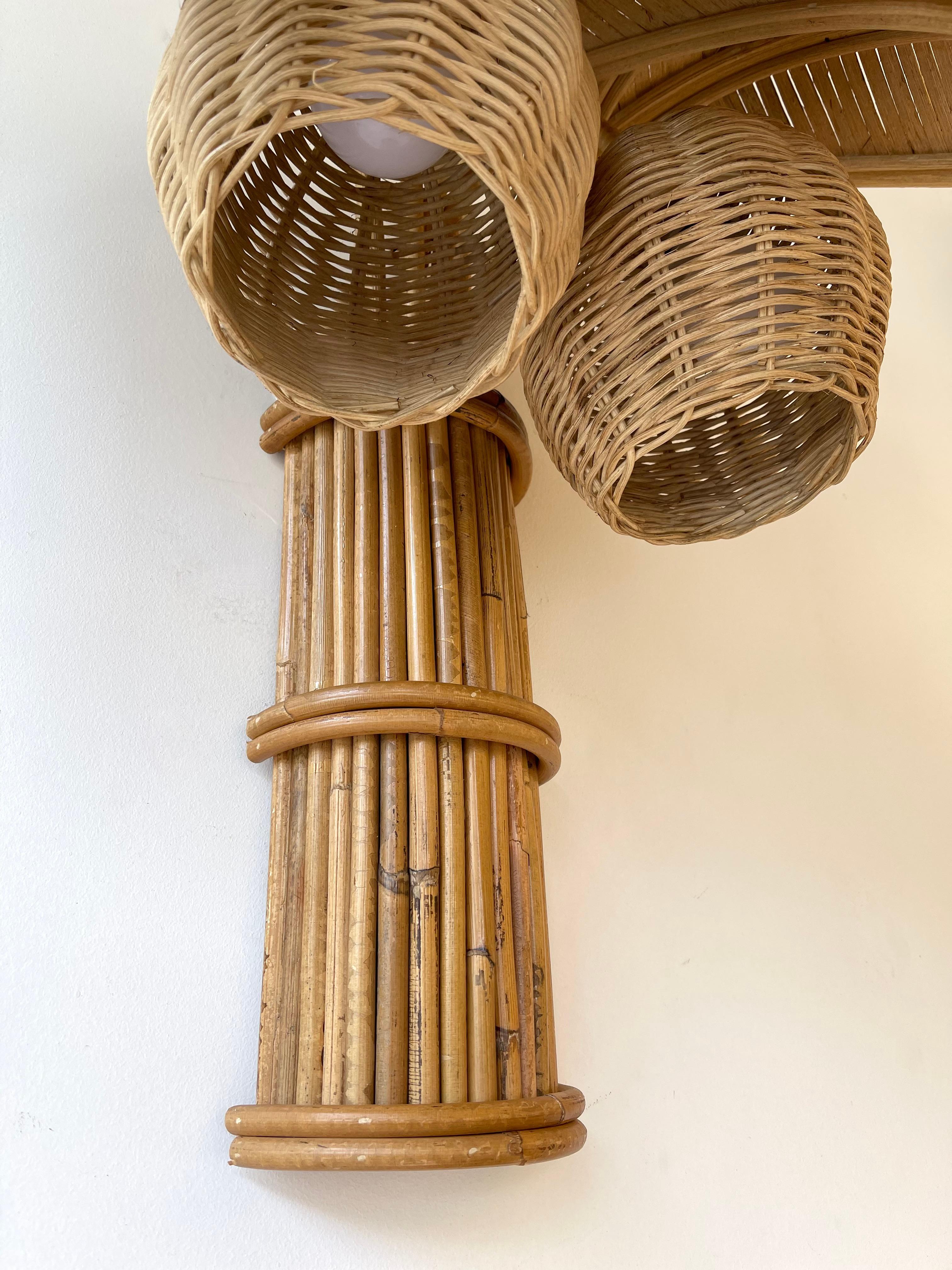 Pair of rattan wicker coconut palm tree wall lights lamps sconces. Artisanal work in  the style of Mario Lopez Torres, Galerie Maison & Jardin, Jansen, Dal Vera, Vivai Del Sud,  Hollywood Regency.

 