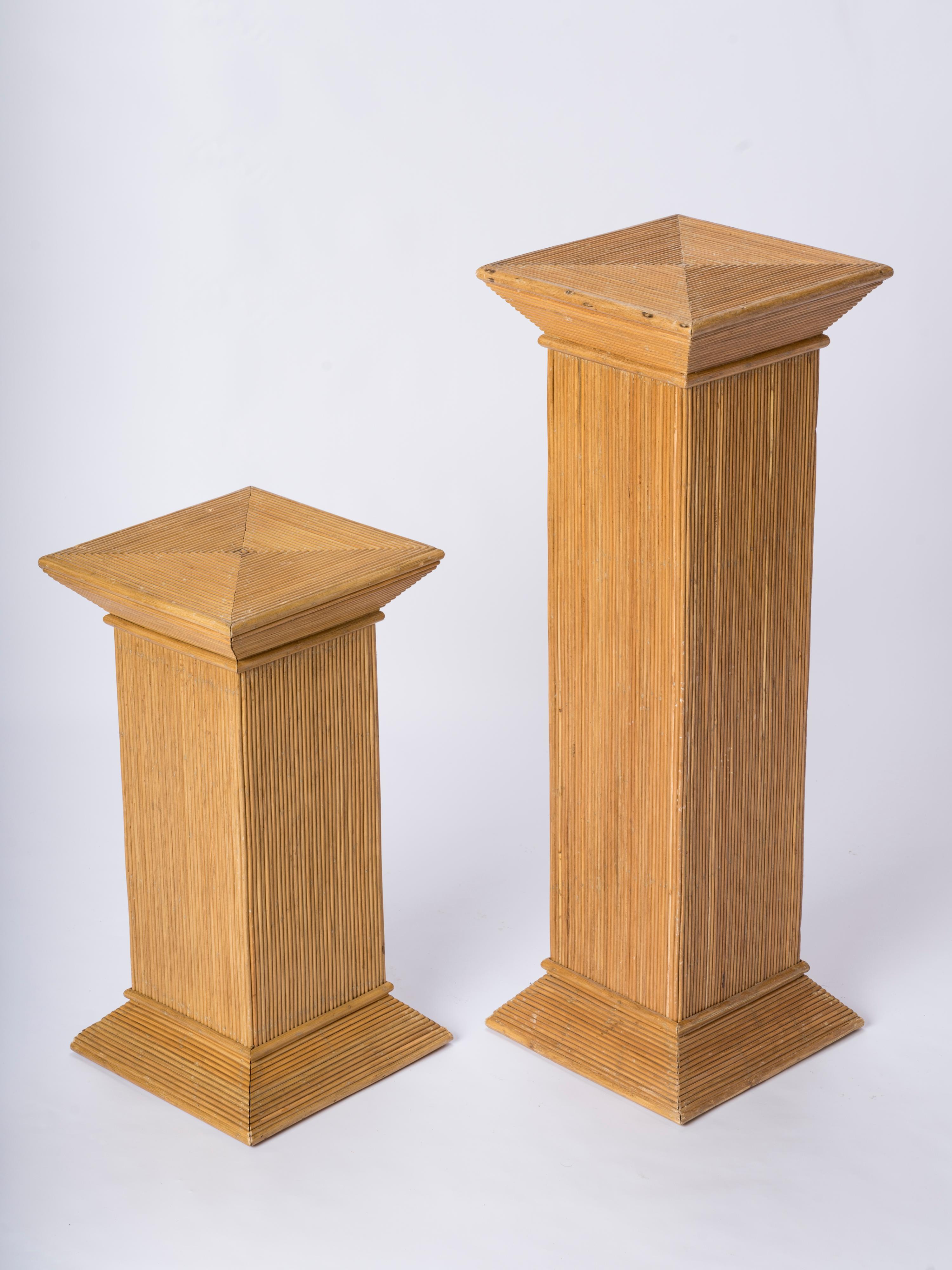 Pair of neo classical rattan marquetry pedestals attributed to Vivai del Sud. Symetrical base and top perspective endings.  In fair condition. Some minor structural damages as shown on pictures. Sturdy.
Dimensions indicated for taller pedestal.