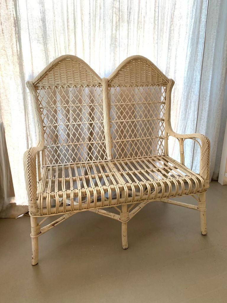 Fantastic pair of vintage 1930s white painted French rattan high back sofas in rarely seen good condition. Perfect patina and in very good condition considering the age. The sofas have very good sitting comfort. 
