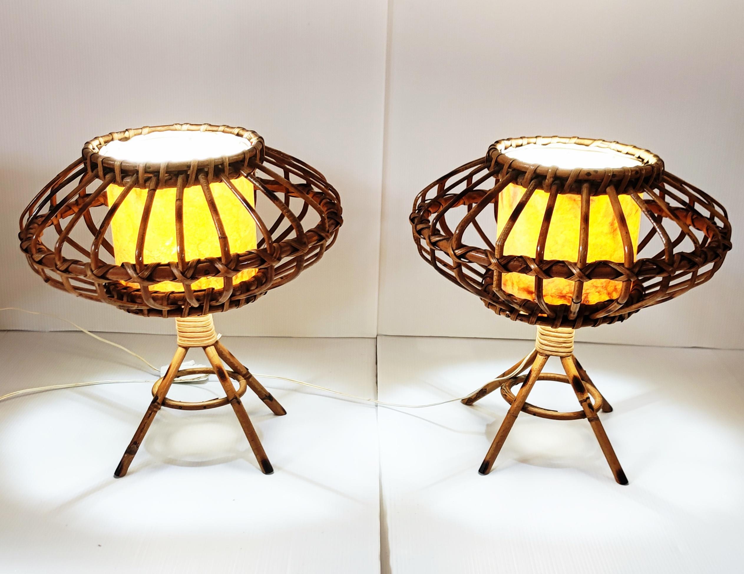 Rare and beautiful pair of rattan and bamboo table lamps manufactured in Spain in 1960s. Very elegant and design form for this pair of 1960s table lamps.