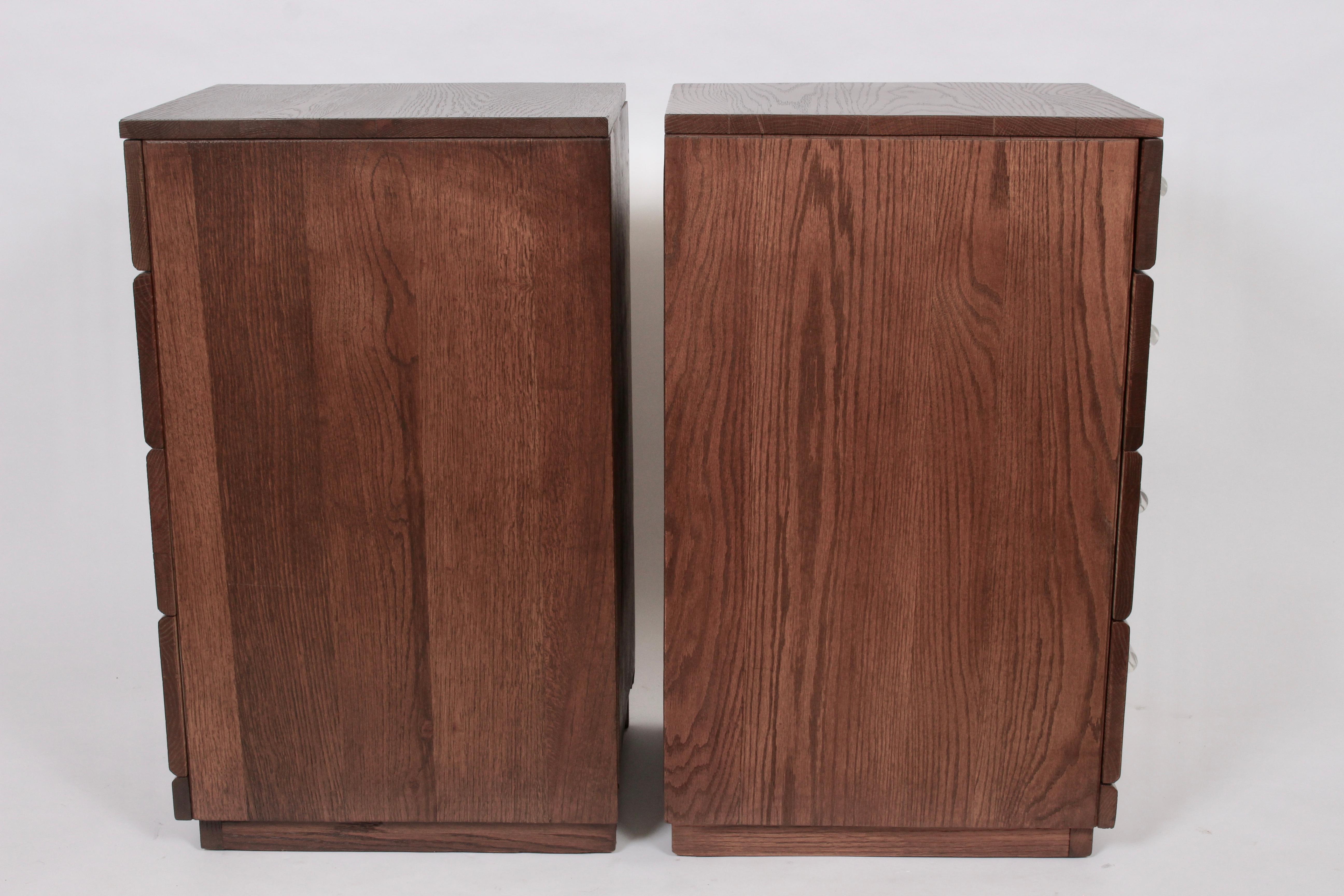 Pair of Raymond Loewy for Mengel 4 drawer stained oak higher bedside tables. Tall, rectangular form with custom Lucite pulls, Chestnut finish, sectional top drawers, fantastic storage. Mengel stamp to inside drawer. Kindly note, Professional