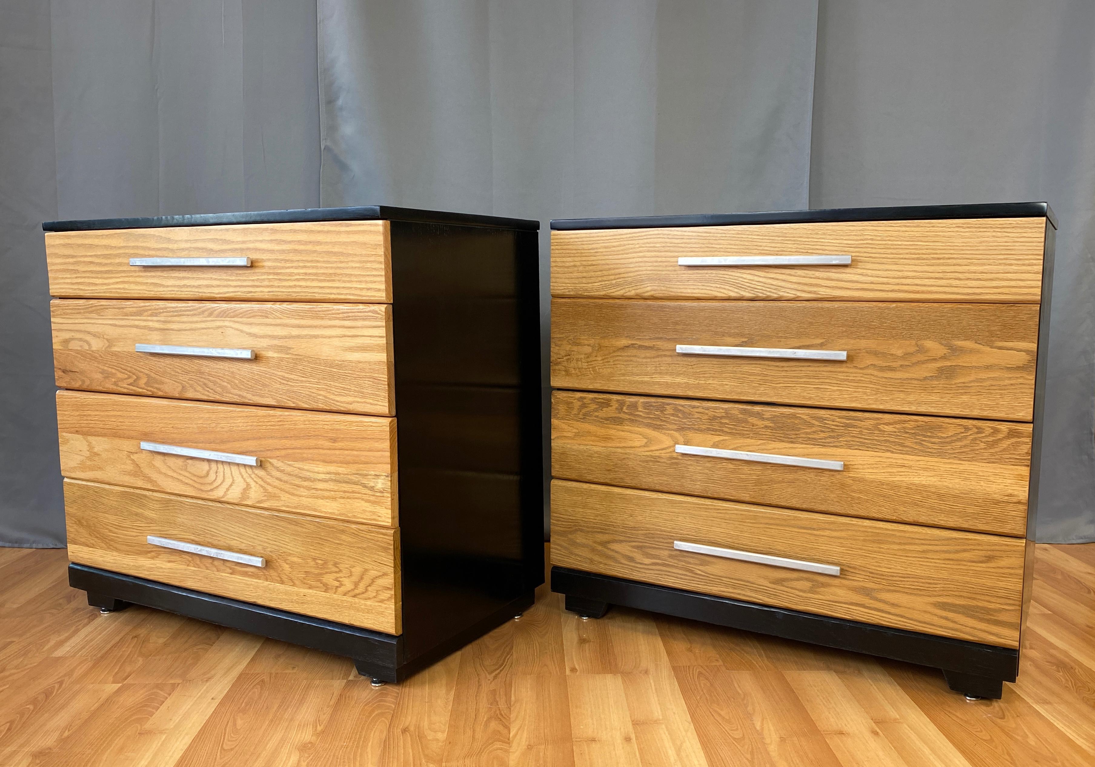 A pair of handsome Raymond Loewy designed dressers for Mengel, circa 1950s 
Both dressers have a nice contrast finish, natural oak and then ebonized black main body. Aluminum handles on each of the four drawers.
