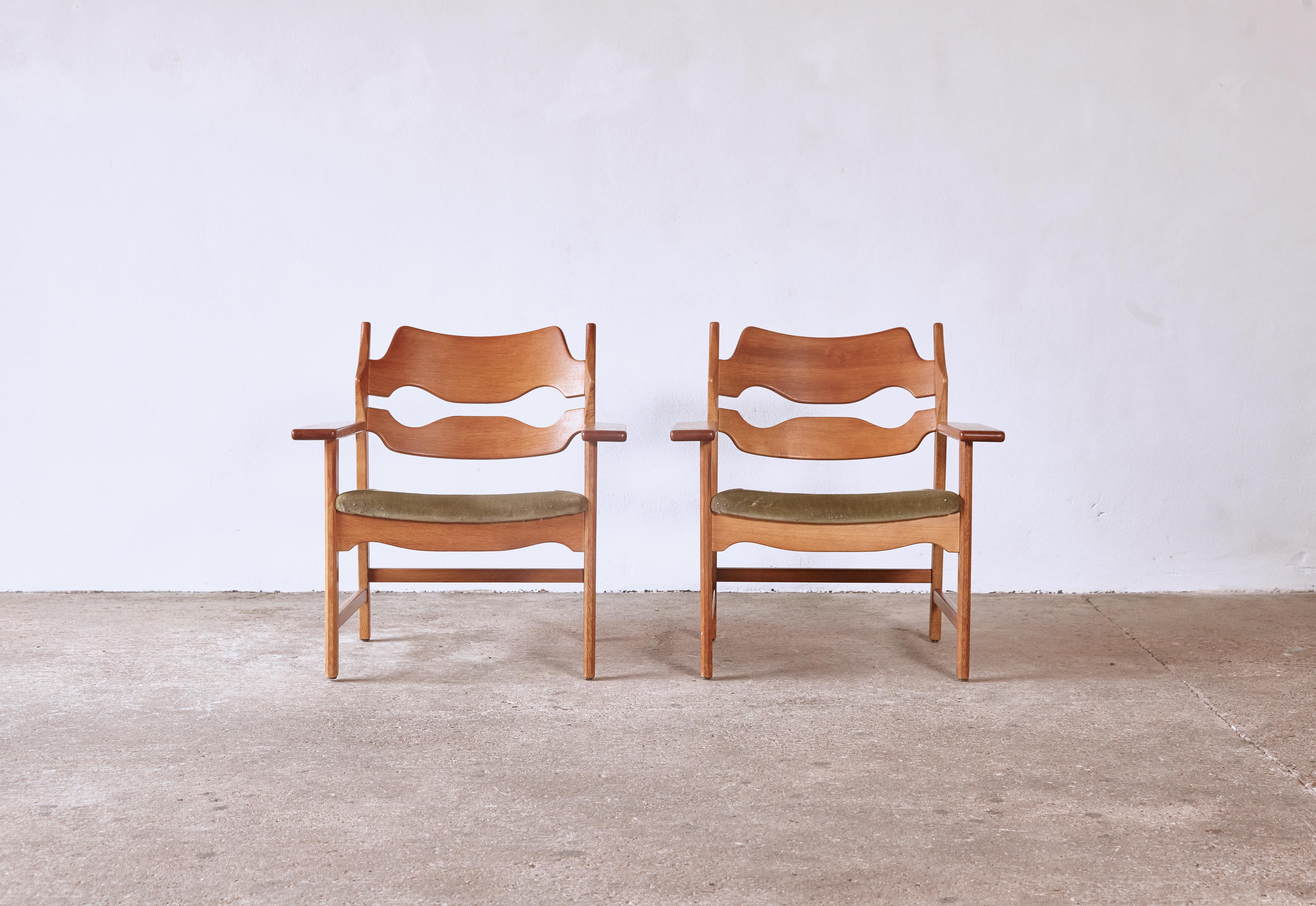 A superb pair of razor blade armchairs by Henning Kjærnulf, Denmark, 1960s. Oak frames in excellent original condition with a lovely even tone and patina. Stamped with the makers mark. Reupholstering the seats of these chairs is easily