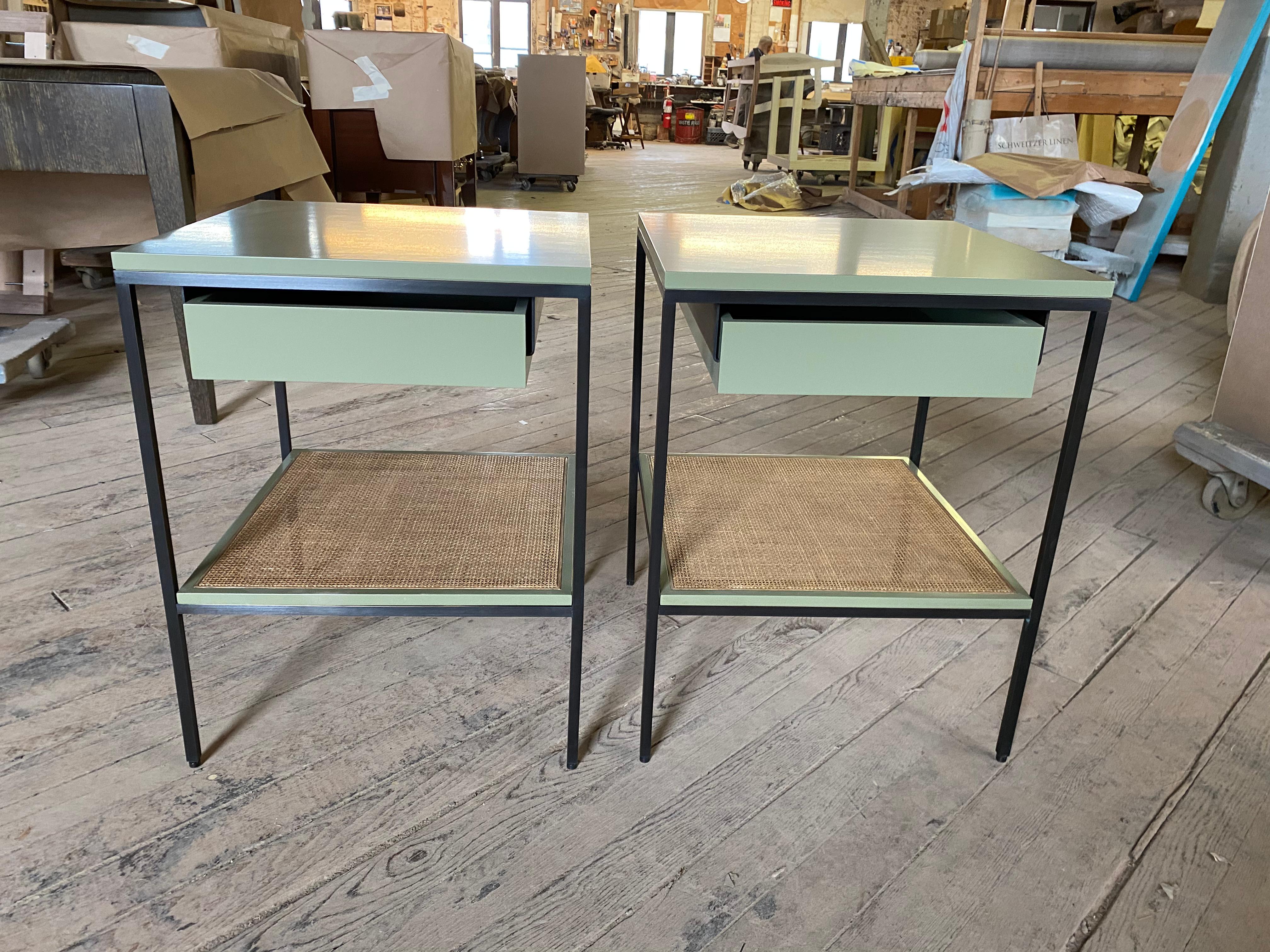 Our classic lacquer, cane and bronze bedside tables in our standard size. Shown here in BM Springfield Sage on oiled bronze frames with medium toned caned shelves. Made to order. Local manufacturing with flawless attention to detail.