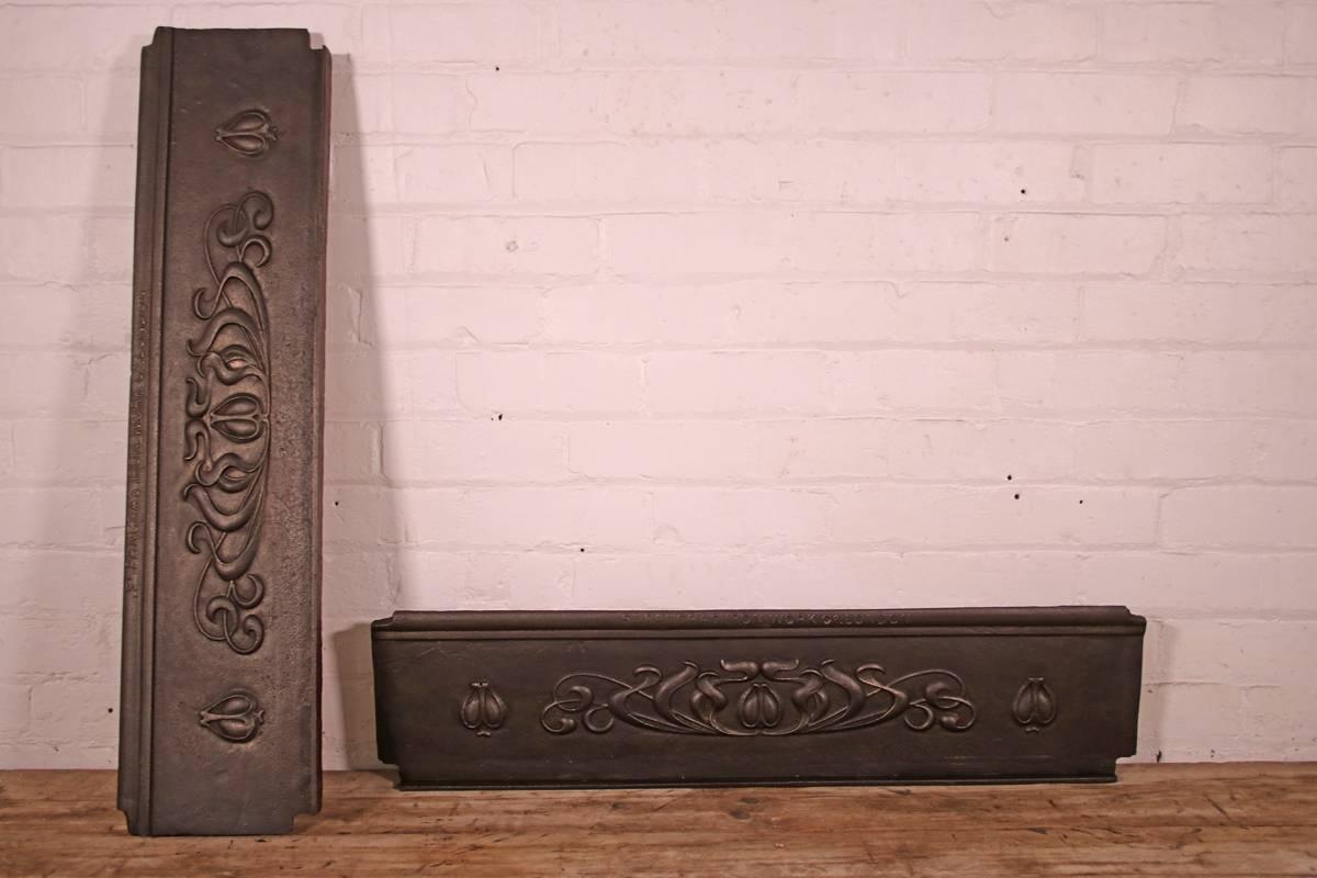 Pair of reclaimed decorative Art Nouveau cast iron stair risers, produced by St. Pancra Iron Work Co. London, circa 1910.

Measure: Overall 96cm wide x 23cm high x 4cm deep (including the original fixings on the backs) 

The fronts finished with