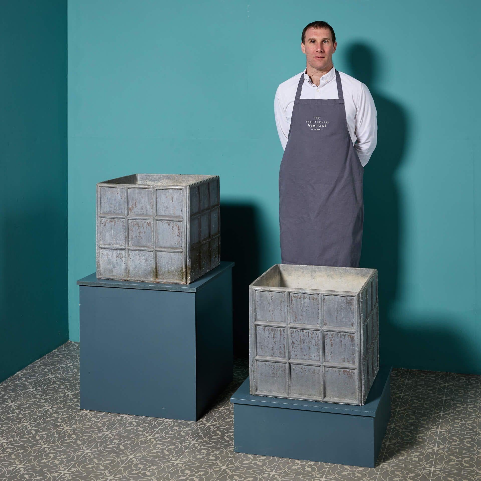 A superb pair of matching reclaimed lead cube planters; a timeless addition to gardens of any age or style! Each lead plant pot is of a matching design with a geometric effect nine panel pattern to all four sides.

With their angular lines and
