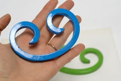 Pair of Reclaimed Steel Paper Weights Refinished in Bright Blue and Green