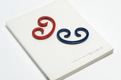 Pair of Reclaimed Steel Paper Weights Refinished in Navy Blue and Ruby Red