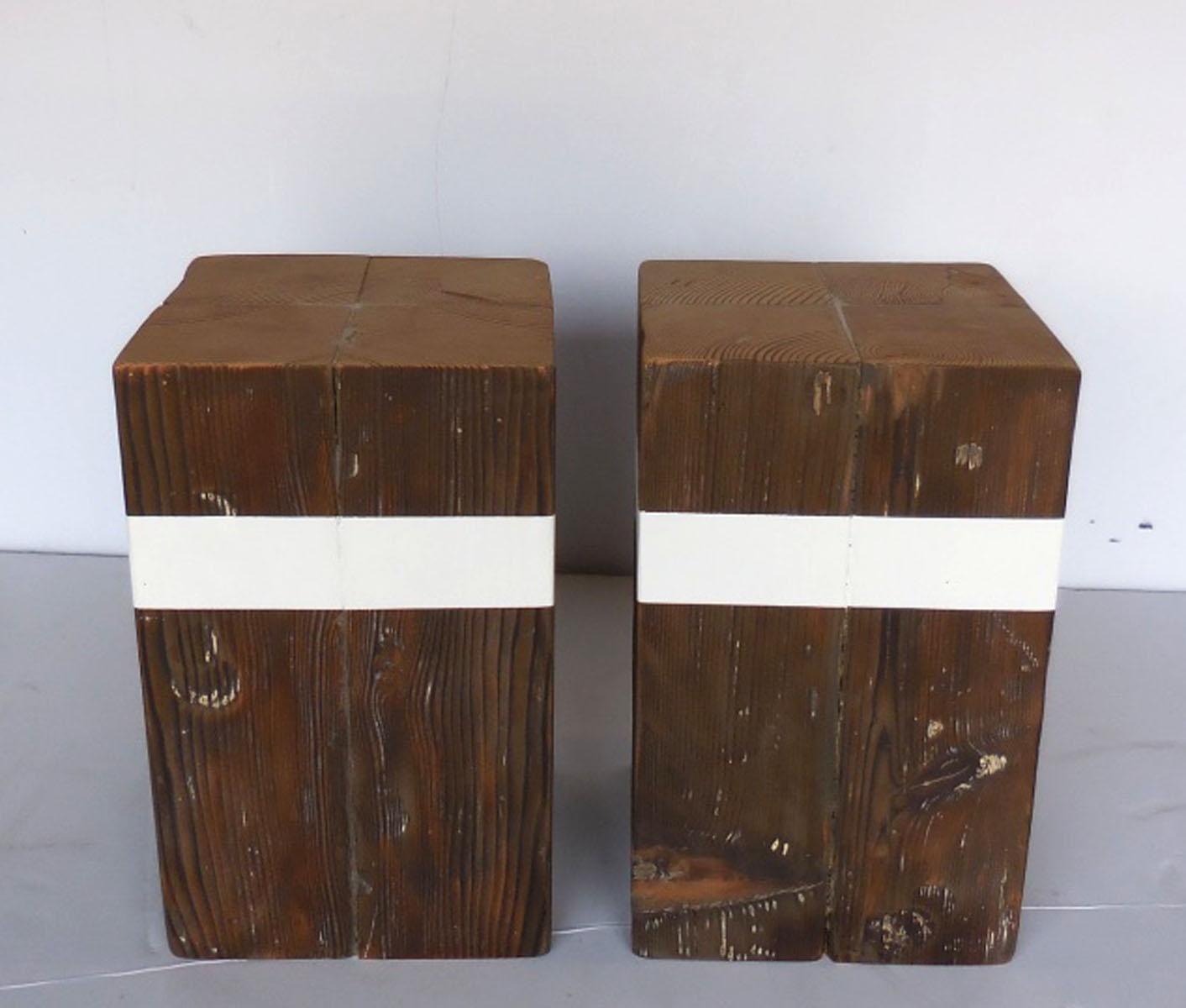 Pair of reclaimed wood rustic modern, organic cube tables with white stripe. Sold as a pair. Old worn patina on wood. Some white paint remnants. New white stripe.