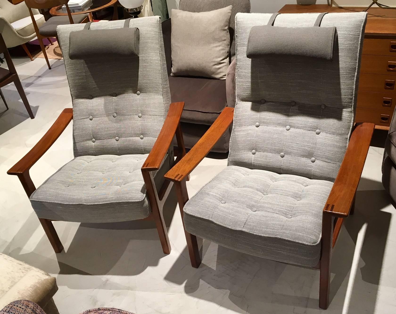 Pair of mid-20th century armchairs, re-upholstered with button tufted grey cotton-blend fabric. Teak frame and armrests, adjustable reclining back. Removable neck pillow. Manufactured by Broderna Andersson in Sweden. Very comfortable.