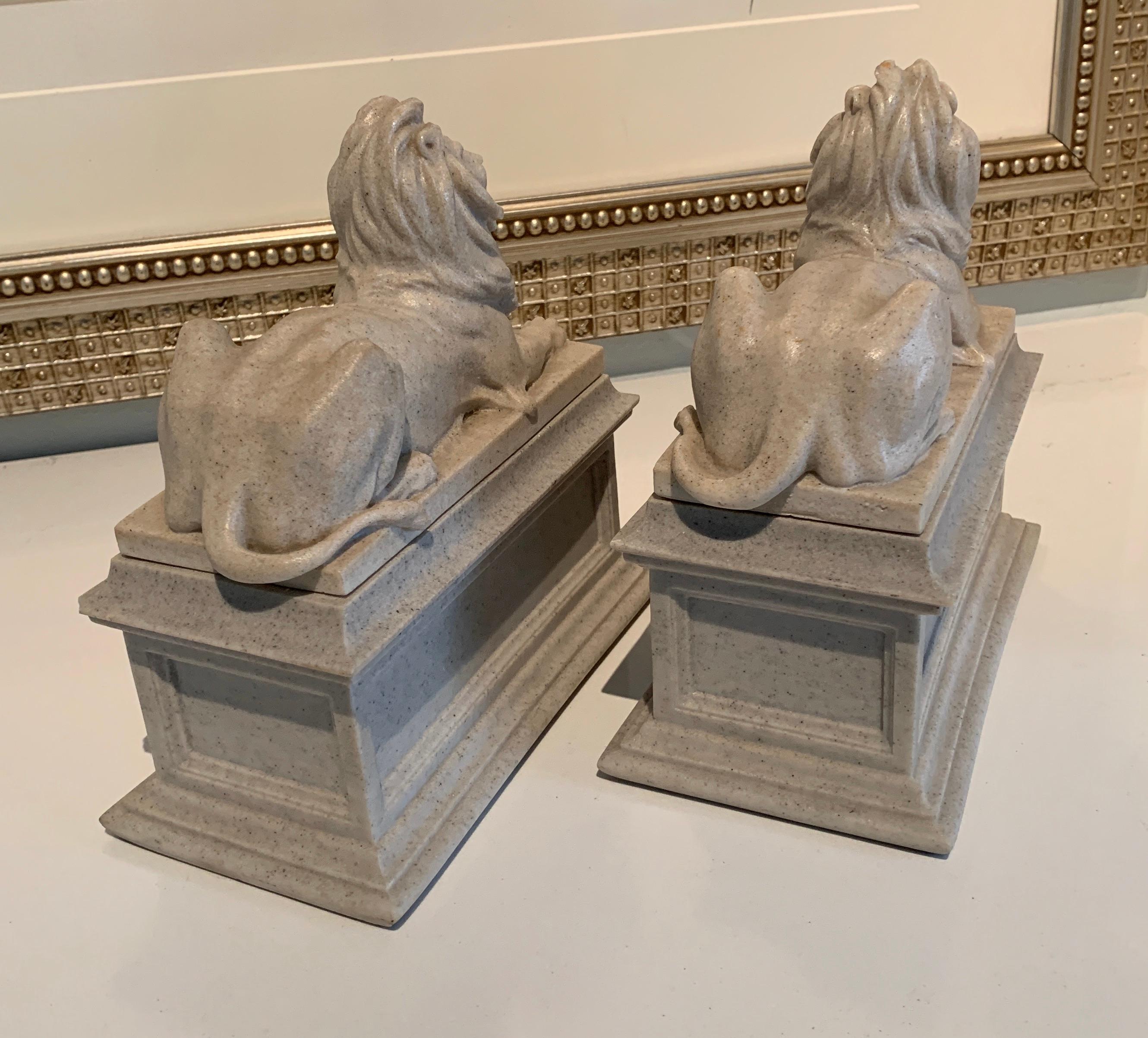 Molded Pair of Reclining Lion Bookends For Sale