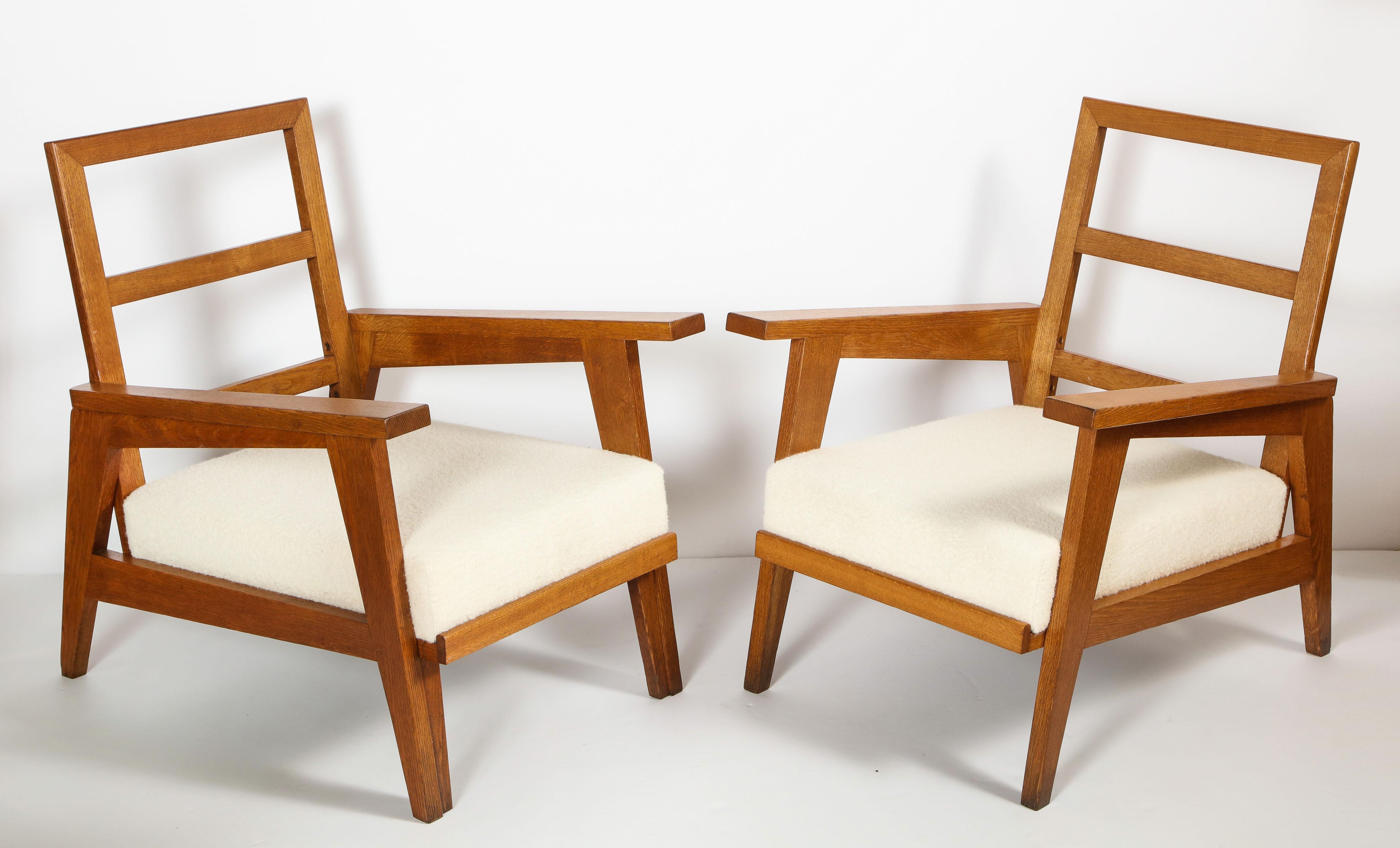 Pair of solid Oak armchairs attributed to Rene Gabriel, newly refinished and upholstered.