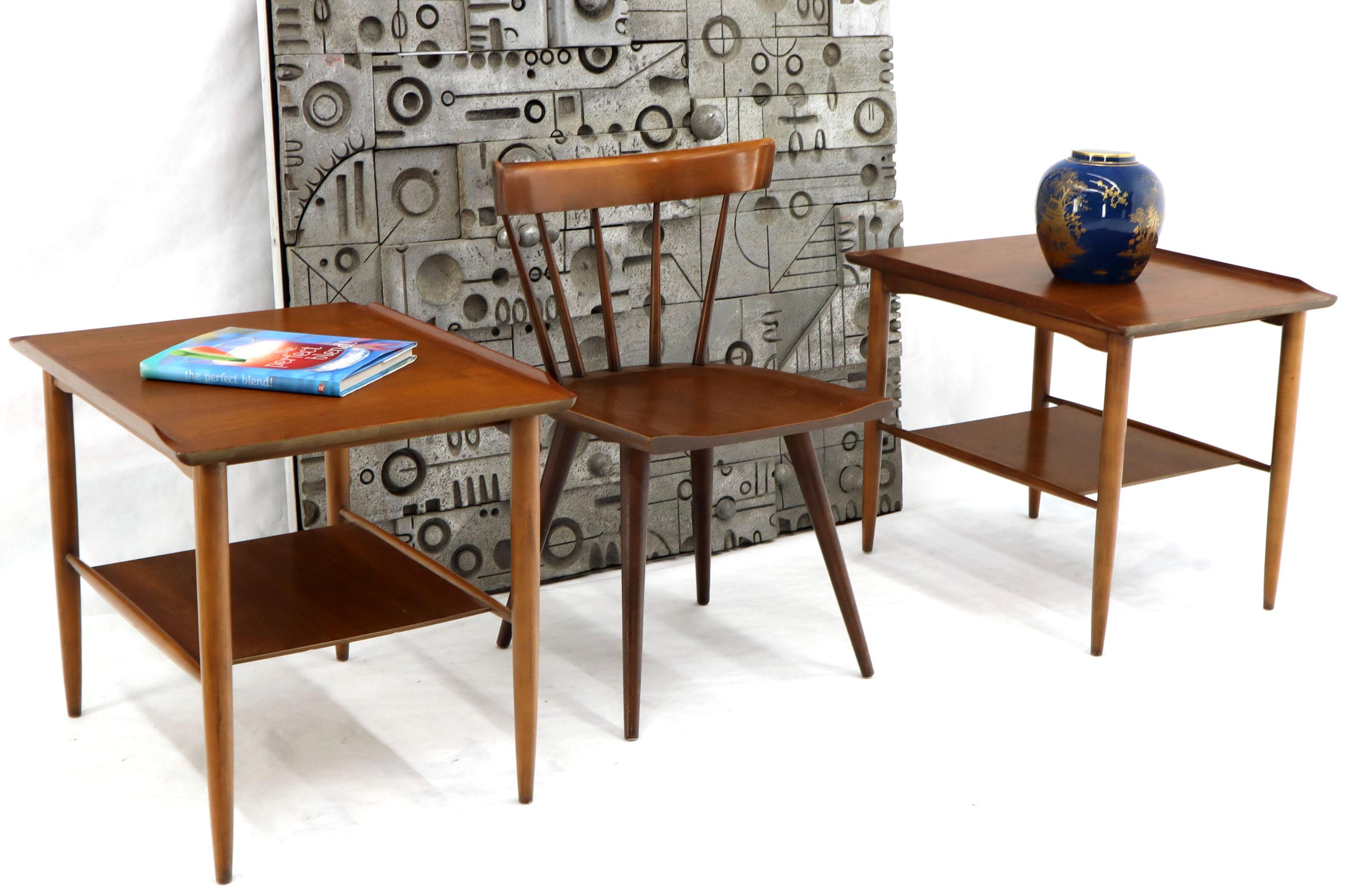 Mid-Century Modern teak or walnut rolled edge end side tables stands with magazine rack or shelf. Sculptured and nicely tapered legs solid and carved rolled edges. Nice medium brown walnut color.