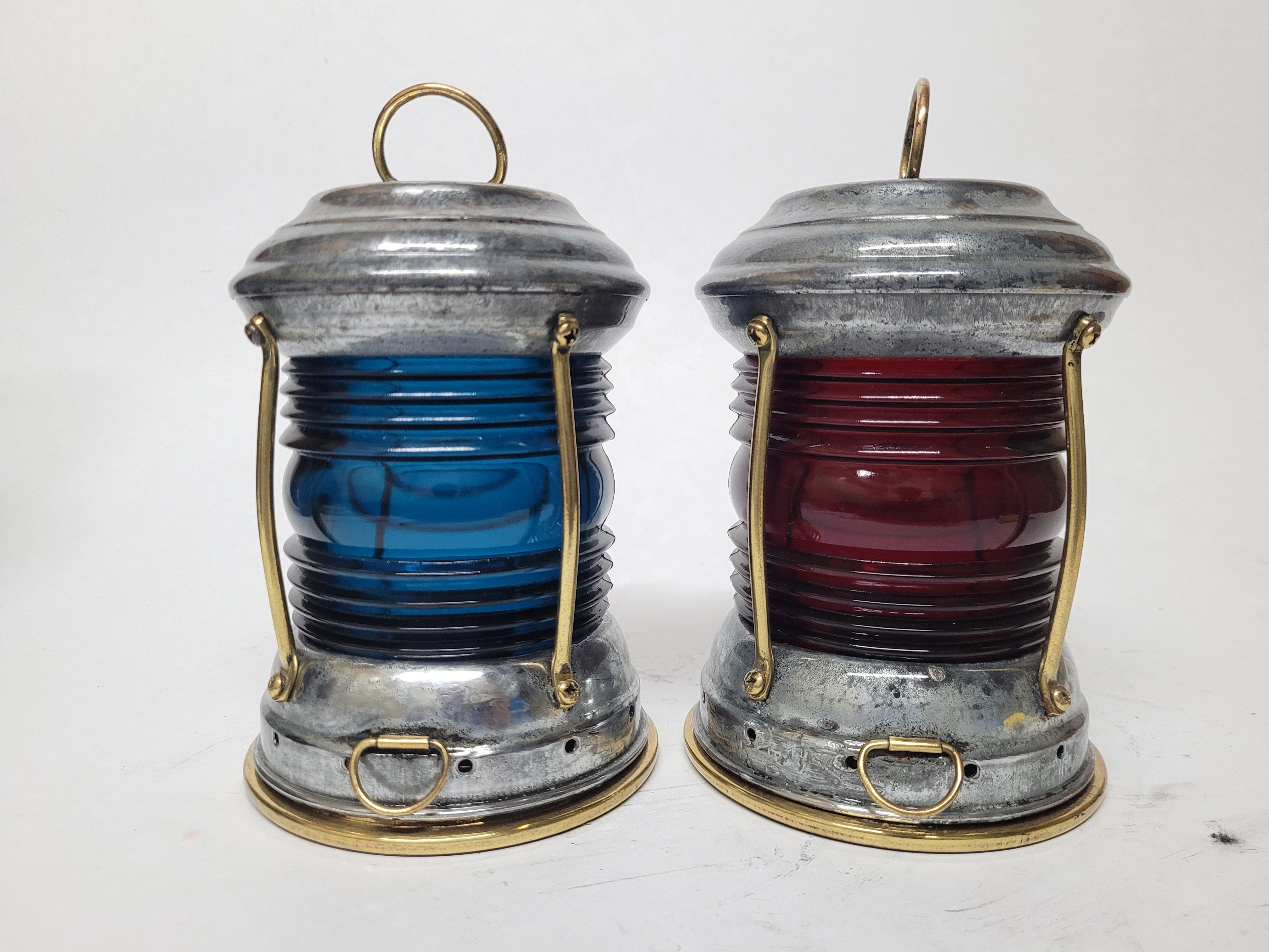 Old pair of boat lanterns with fresnel lenses, steel cases, protective brass bars and carry rings, heavy little things, great bookcase accents.

Weight: 1.78 lbs.
Overall Dimensions: 7 1/2
