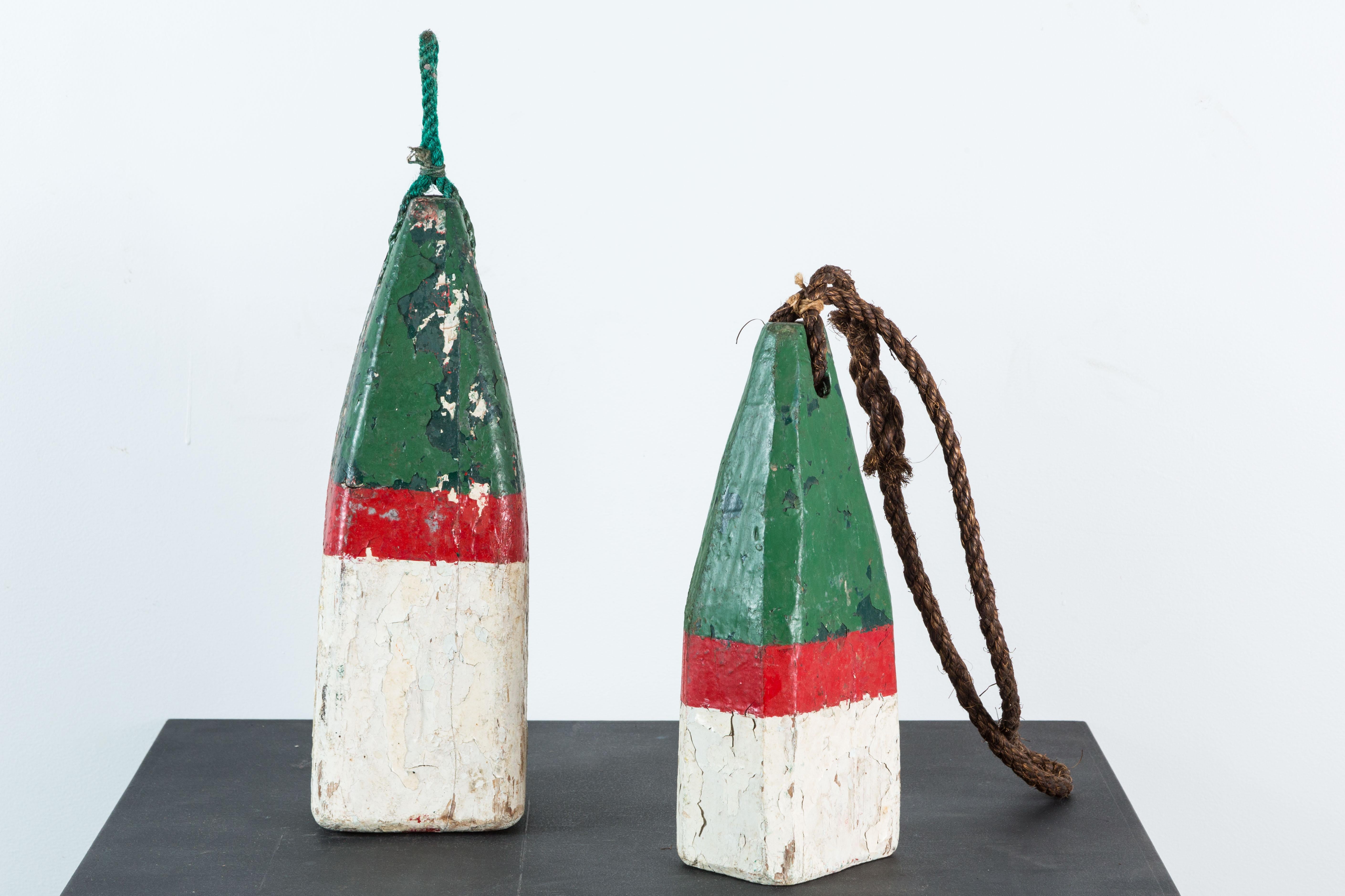 Nice pair of vintage red and green American nautical buoys. Original hand painted surface. Found in the north east. Layers of original paint. First buoy measures 15.5 x 5