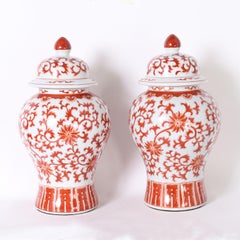 Pair of Red and White Porcelain Lidded Urns or Jars