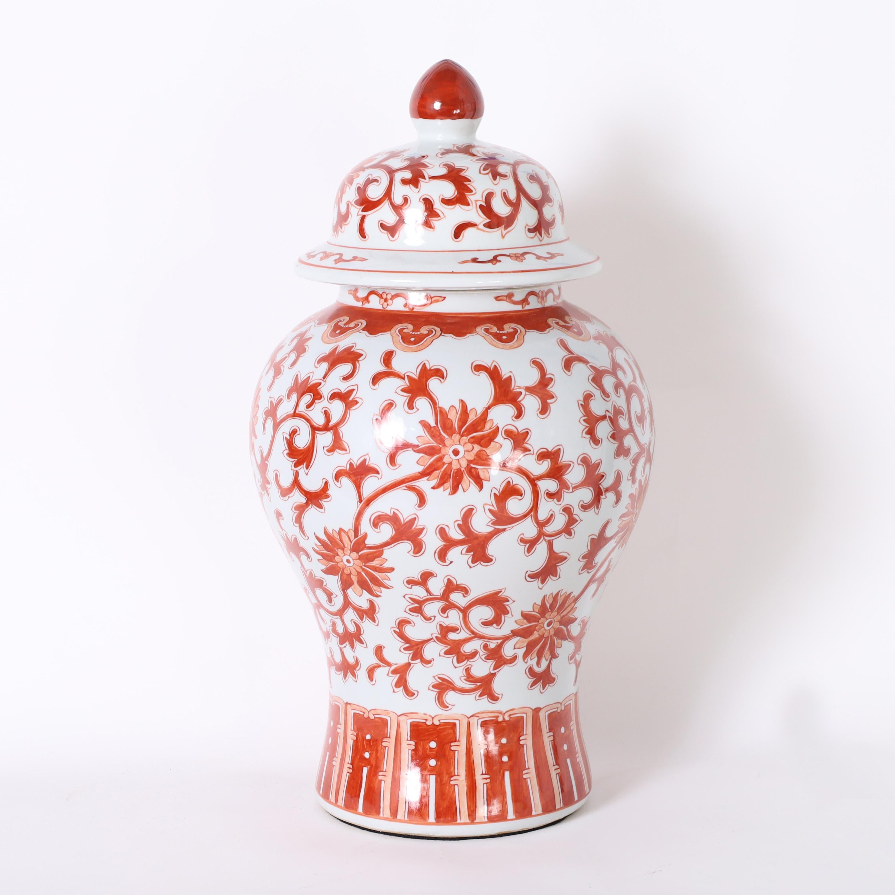 Chinese Export Pair of Red and White Porcelain Lidded Urns or Jars For Sale