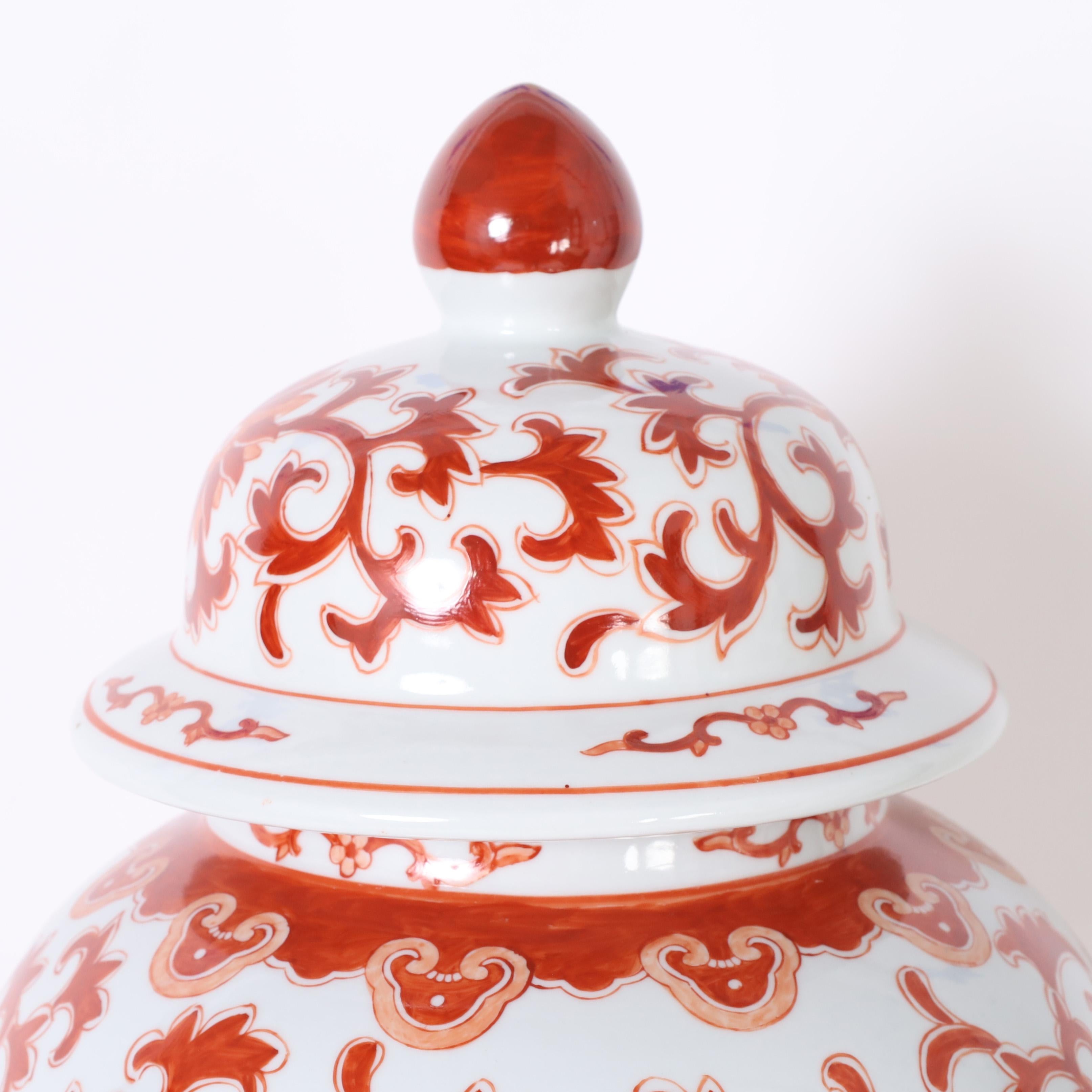 Chinese Pair of Red and White Porcelain Lidded Urns or Jars For Sale