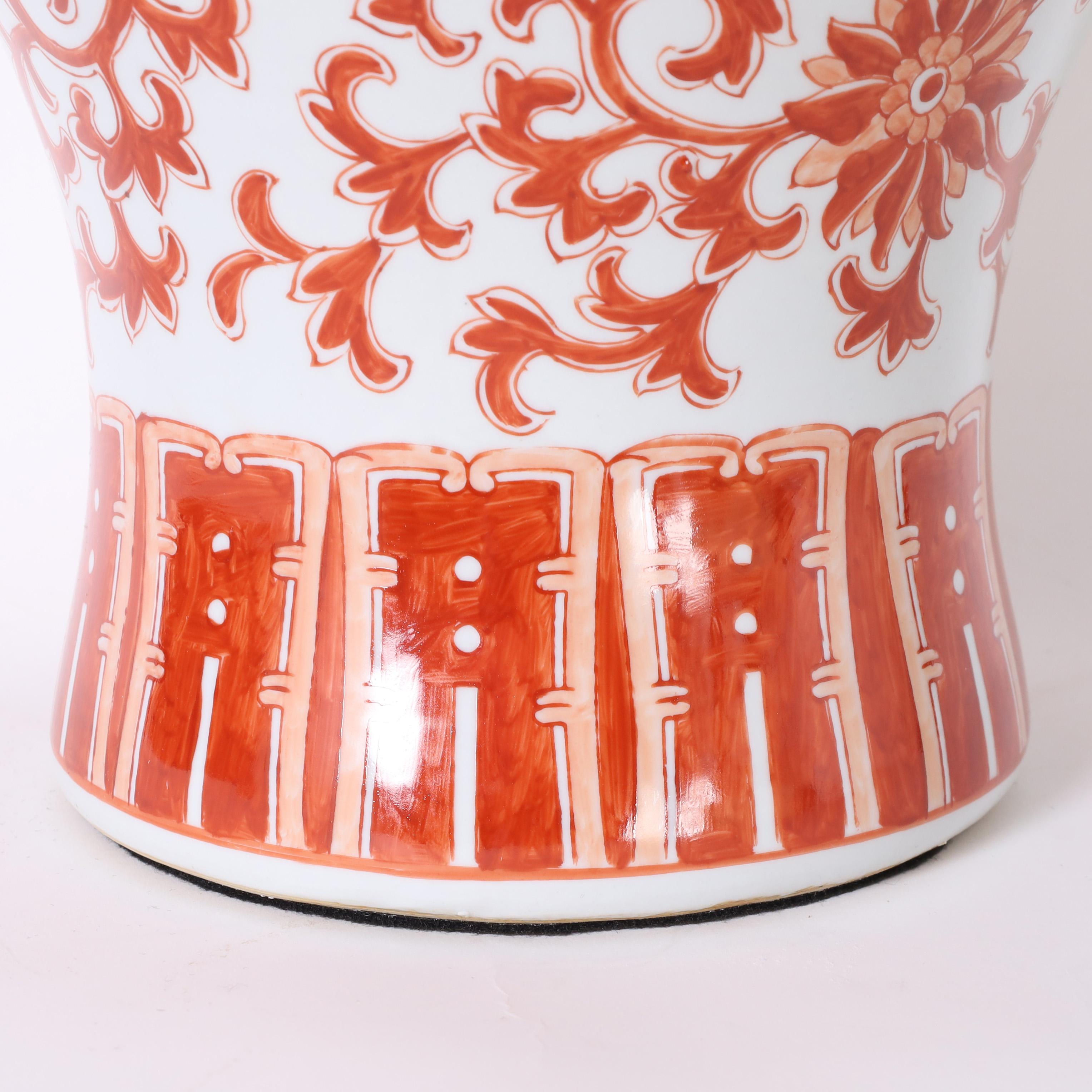Pair of Red and White Porcelain Lidded Urns or Jars In Good Condition For Sale In Palm Beach, FL